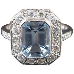 1.20 Carat Emerald Cut Aquamarine and Diamond Cluster Ring in the Art Deco Style