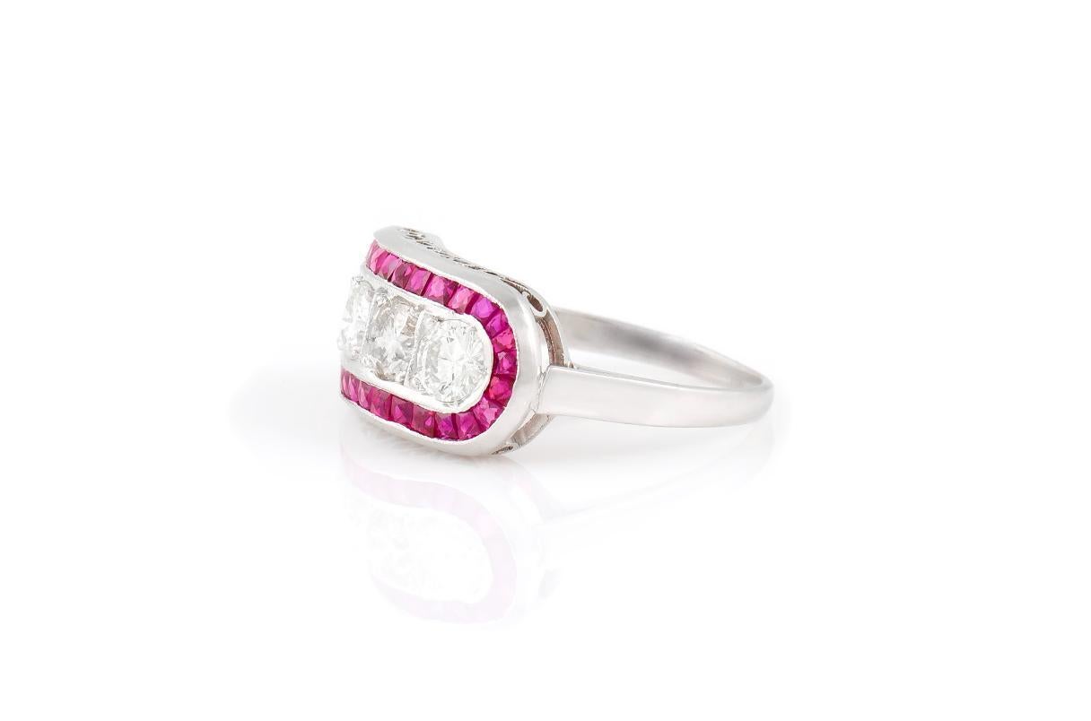 Finely crafted in platinum featuring four Round Brilliant cut Diamonds weighing a total of approximately 1.20 carat and French cut Rubies weighing a total of approximately 1.20 carat.
Size 5 3/4, resizable