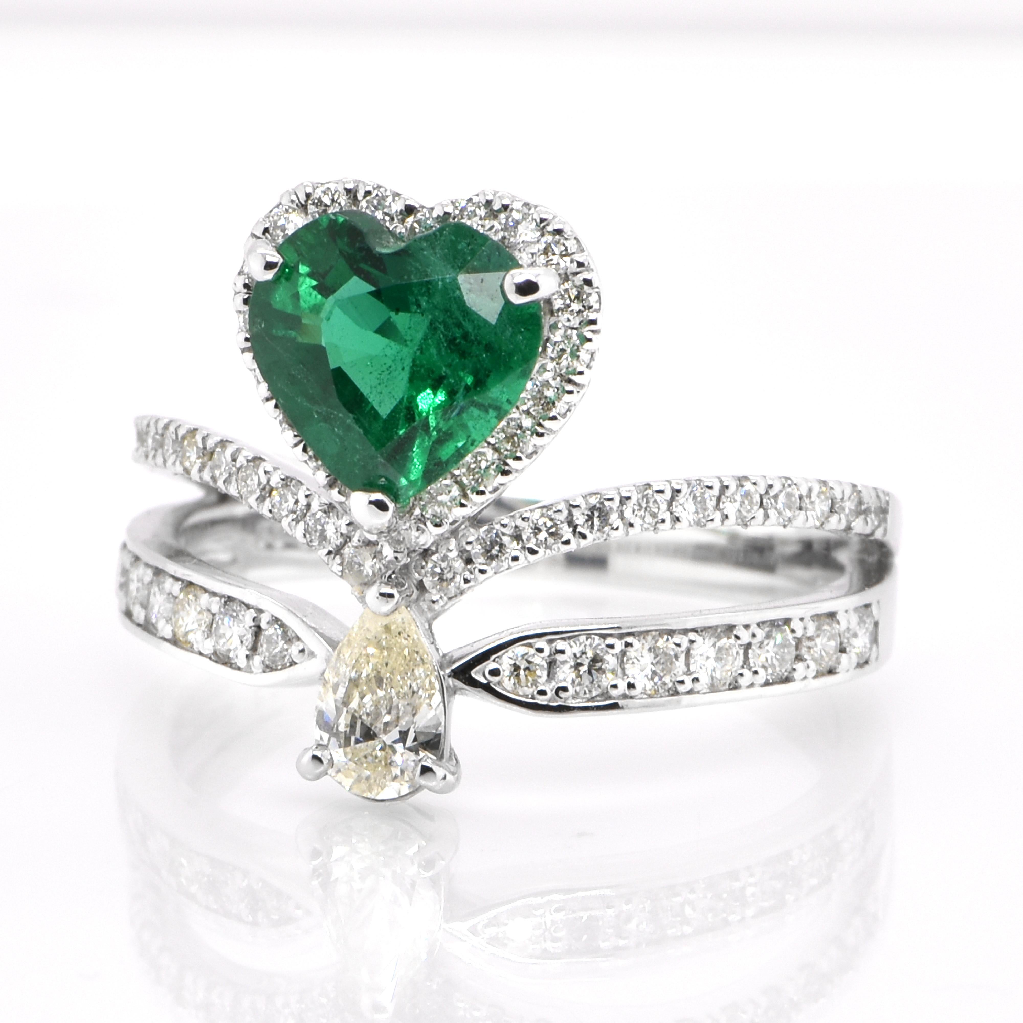 A stunning ring featuring a 1.20 Carat Natural Zambian Emerald and 0.68 Carats of Diamond Accents set in Platinum. People have admired emerald’s green for thousands of years. Emeralds have always been associated with the lushest landscapes and the
