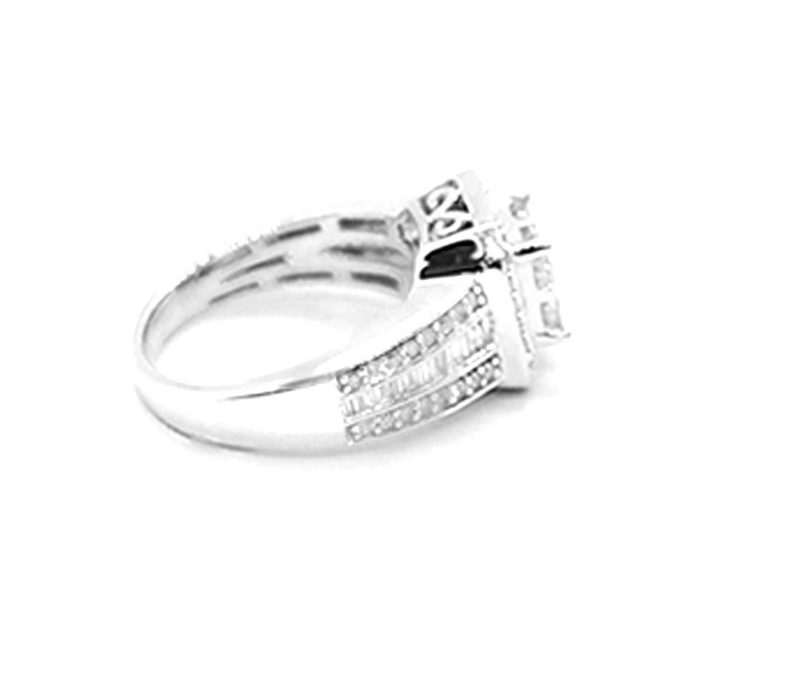 1.20 Carat Invisible Diamond Princess and Baguette Ring set in a contemporary 11.50 mm halo. The ring is set with micro pave diamonds surrounding the 4-princess cut center stones. A sturdy and durable setting has channel baguette diamonds on the