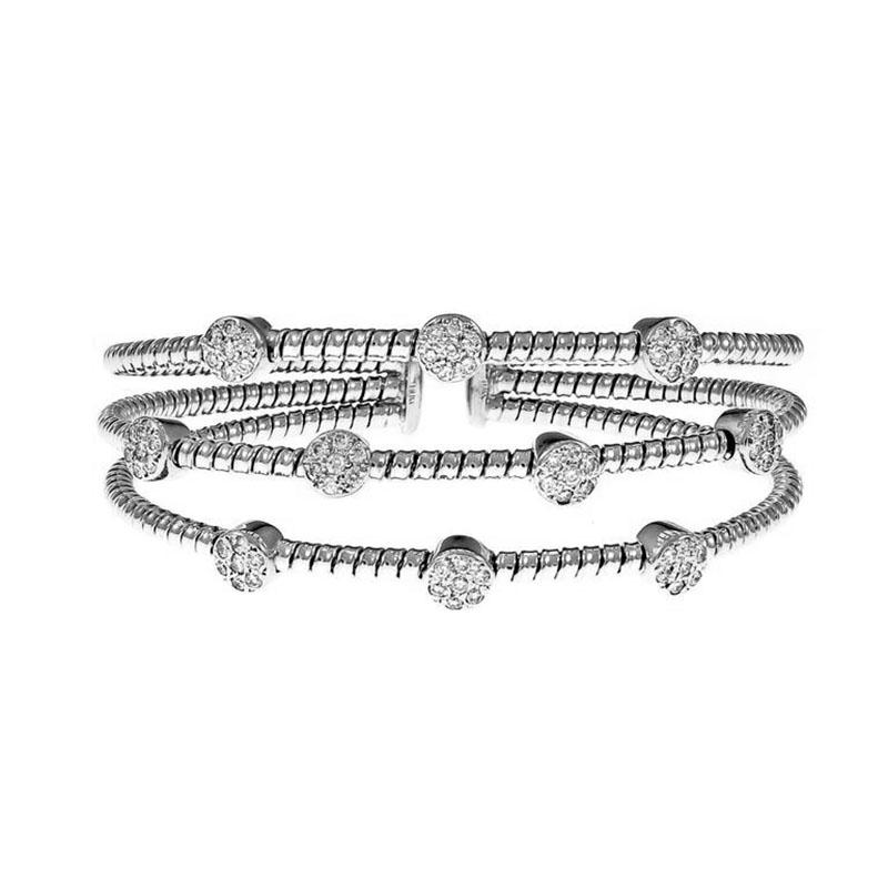 Three row Italian Diamond bangle bracelet. 70 round full cut pave set diamonds in 10 round bezels. 18k white gold.

70 round full cut Diamonds, approx. total weight 1.20cts, H, SI1
18k white gold
Tested and stamped: 18k
Hallmark: Italy
29.6