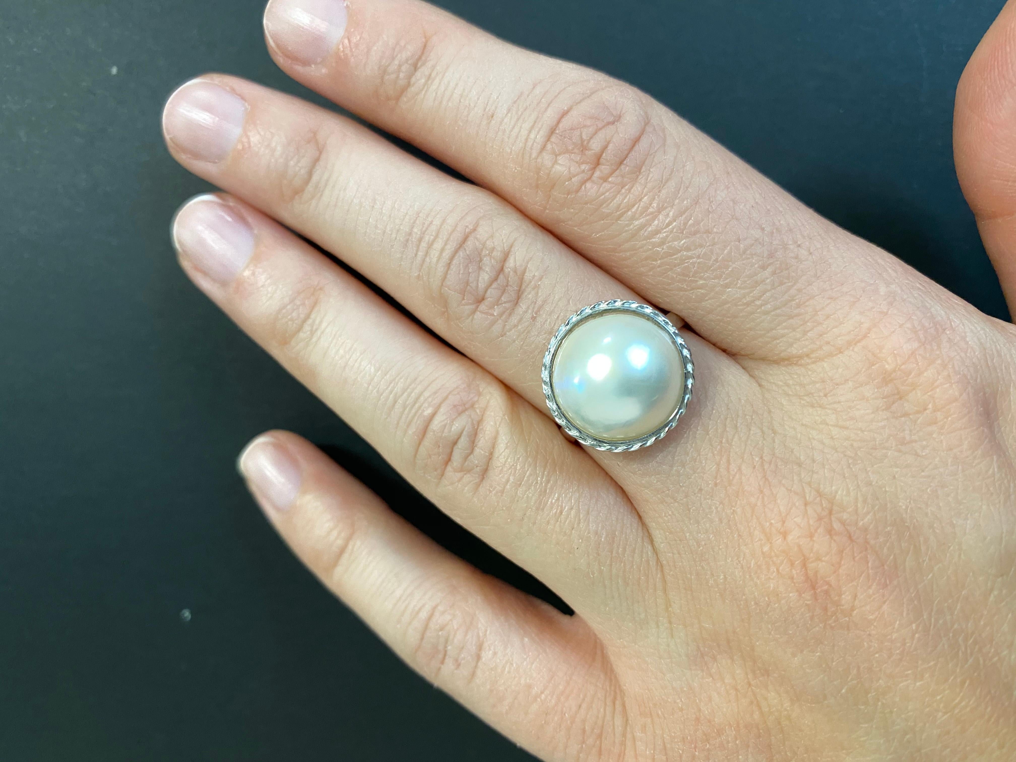 A staple for jewelry collectors everywhere, this 1.20 Carat Mother of Pearl Ring is set in a simple 14k White Gold casting. It is Perfect for anyone at any age and is truly a timeless orniment.

Material: 14k White Gold 
Center Stone Details: 1.20