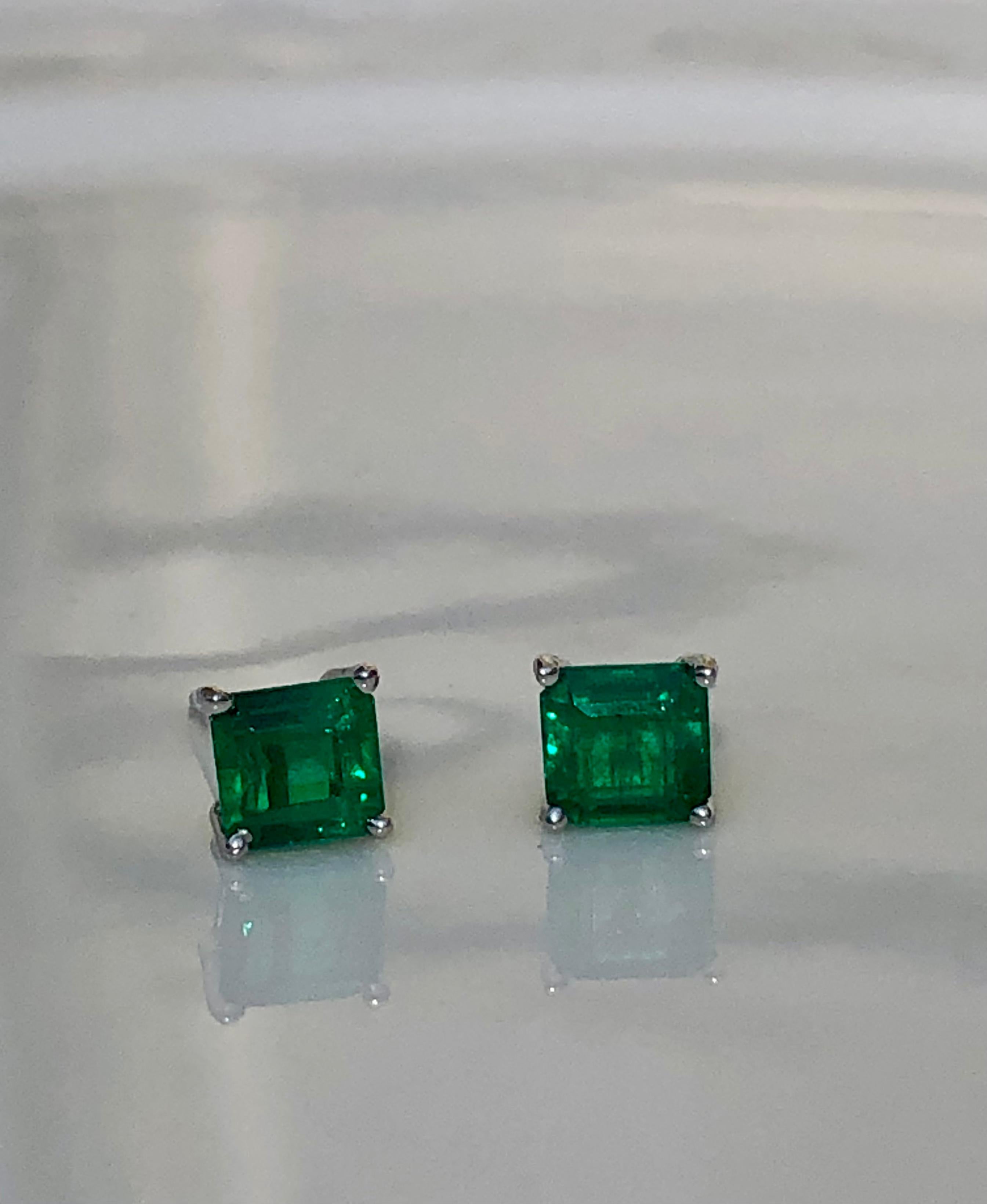 Primary Stones: 100% Natural Colombian Emeralds
Color/Clarity: AAA FINE Medium Green Color/ Clarity, VS
Total Gemstones Weight:  1.20 carats
Shape or Cut: Emerald Cut
Earrings Measurement: 5.19mm x 5.00mm
Comments: Gorgeous Color and