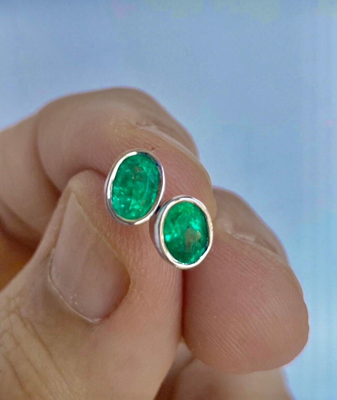 Classic everyday natural Colombian emerald oval stud earrings 18K white gold 
Primary Stones: 100% Natural Colombian Emerald 
Shape or Cut: Oval Cut 
Average Color/Clarity : Medium Green/ Clarity, VS 
Weight Emeralds: Approx. 1.20 Carats  
Earrings