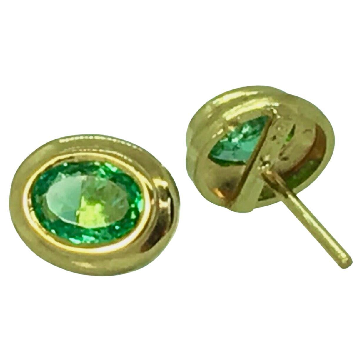 Pendientes de oro blanco de 18 quilates con esmeralda ovalada colombiana natural de 1,20 quilates