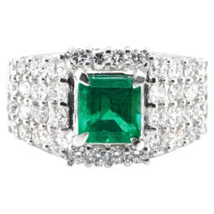 1.20 Carat Natural Emerald and 1.55 Carat Natural Diamonds Ring Set in Platinum