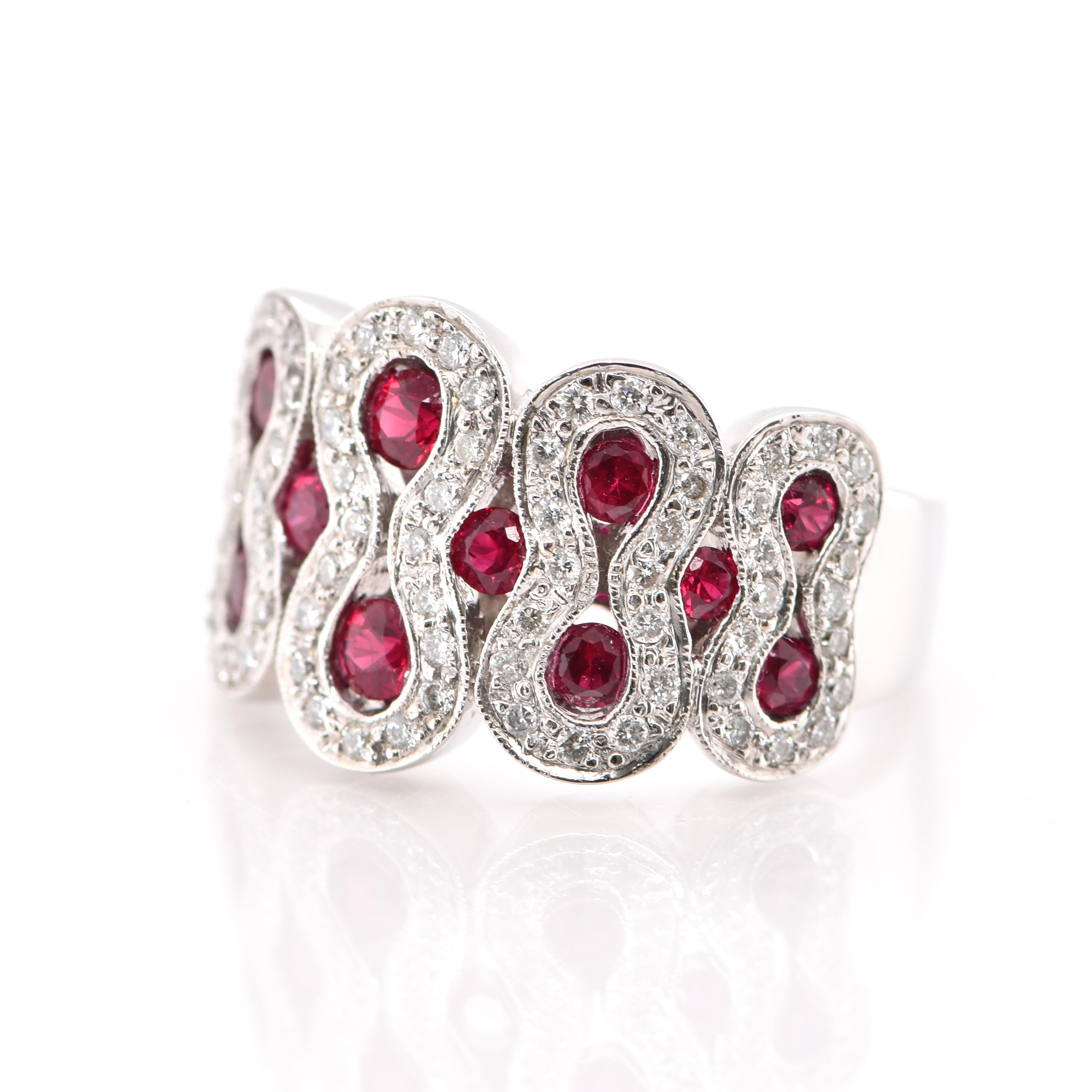 A beautiful Cocktail Ring featuring a total 1.20 Carats of Natural Ruby and 0.60 Carats of Diamond Accents set in 18 Karat White Gold. Rubies are referred to as 