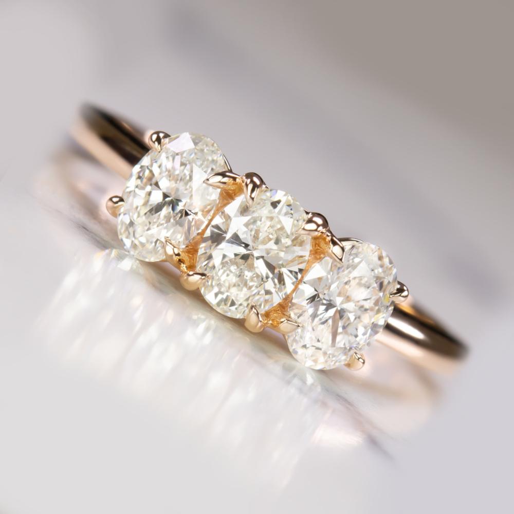 Oval Cut 1.20 Carat Oval Diamond 14K Rose Gold Trilogy Ring For Sale