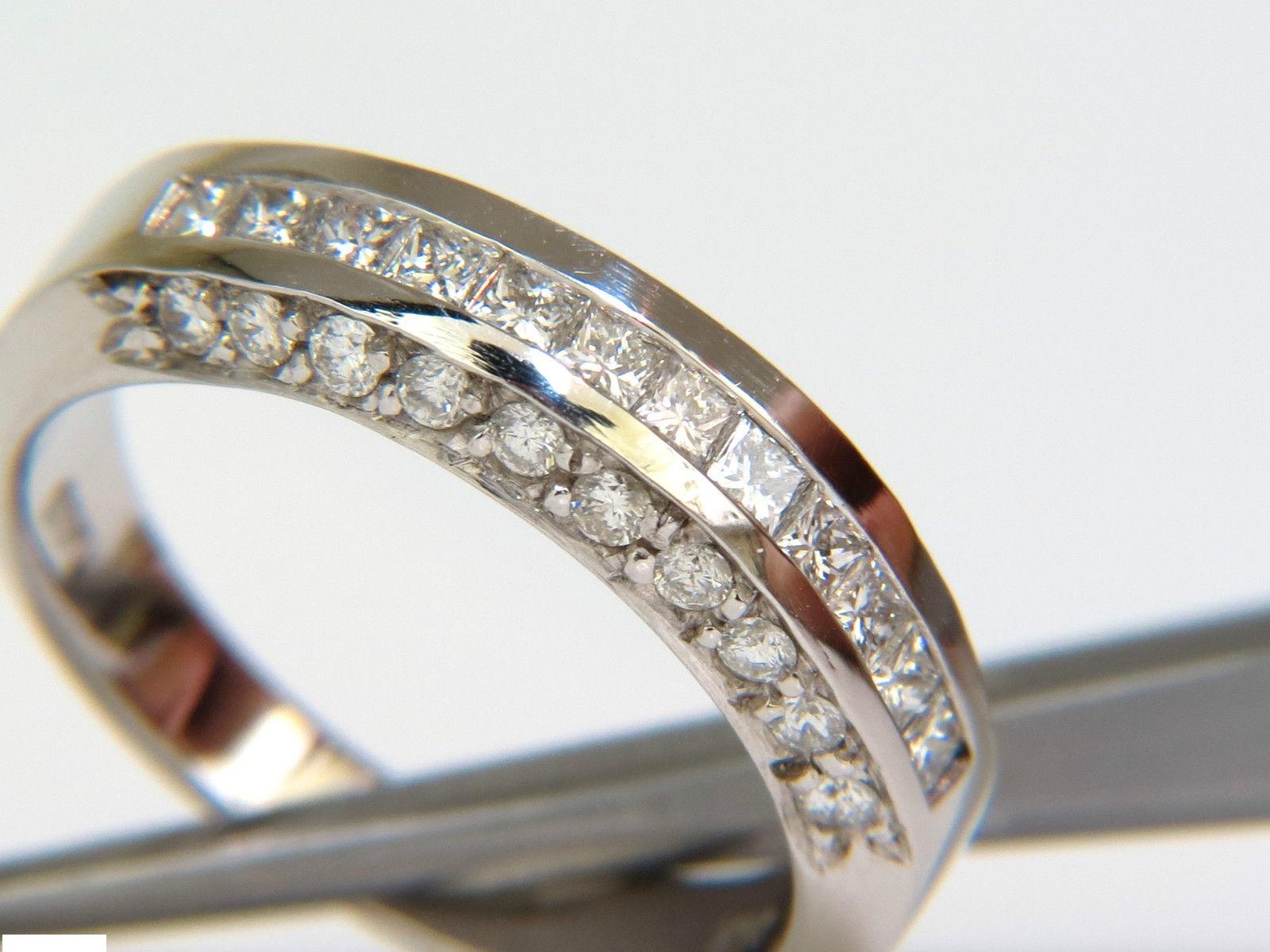 1.20ct. Princes, and rounds diamond band. 
with gorgeous side pave set diamonds
all done by hand!

Full cut princess' and rounds.

G-H color, Vs-2 si-1 clarity.

14kt. White gold.

5.40mm thick 

$4500 Appraisal to accompany.

Current Size: 6 1/2