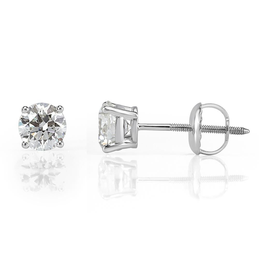 Handcrafted in 18k white gold, this beautiful pair of diamond stud earrings showcases two stunning round brilliant cut diamonds with a total weight of 1.20ct, each GIA certified at I-VS1 and I-VS2.
