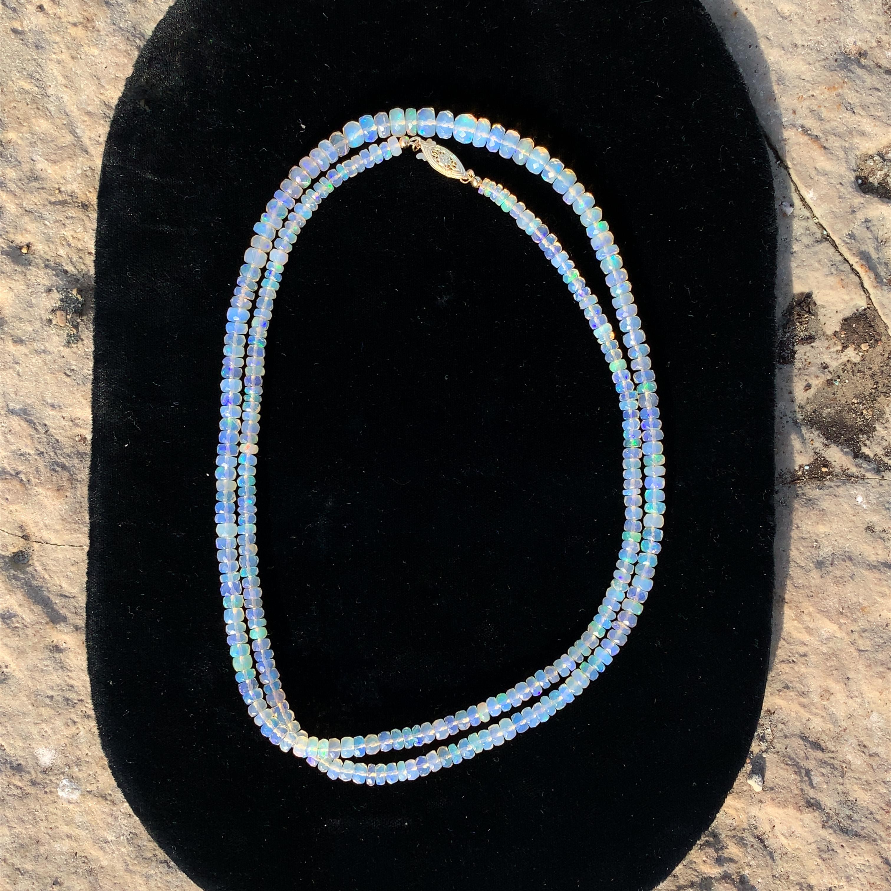 A long graduated strand of natural earth mined Welo opal beads weighing 120 carats total. The necklace measures 33.5