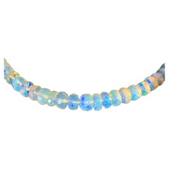 120 carat Strand of Opal Beads 33.5" long with 14K Yellow Gold Clasp