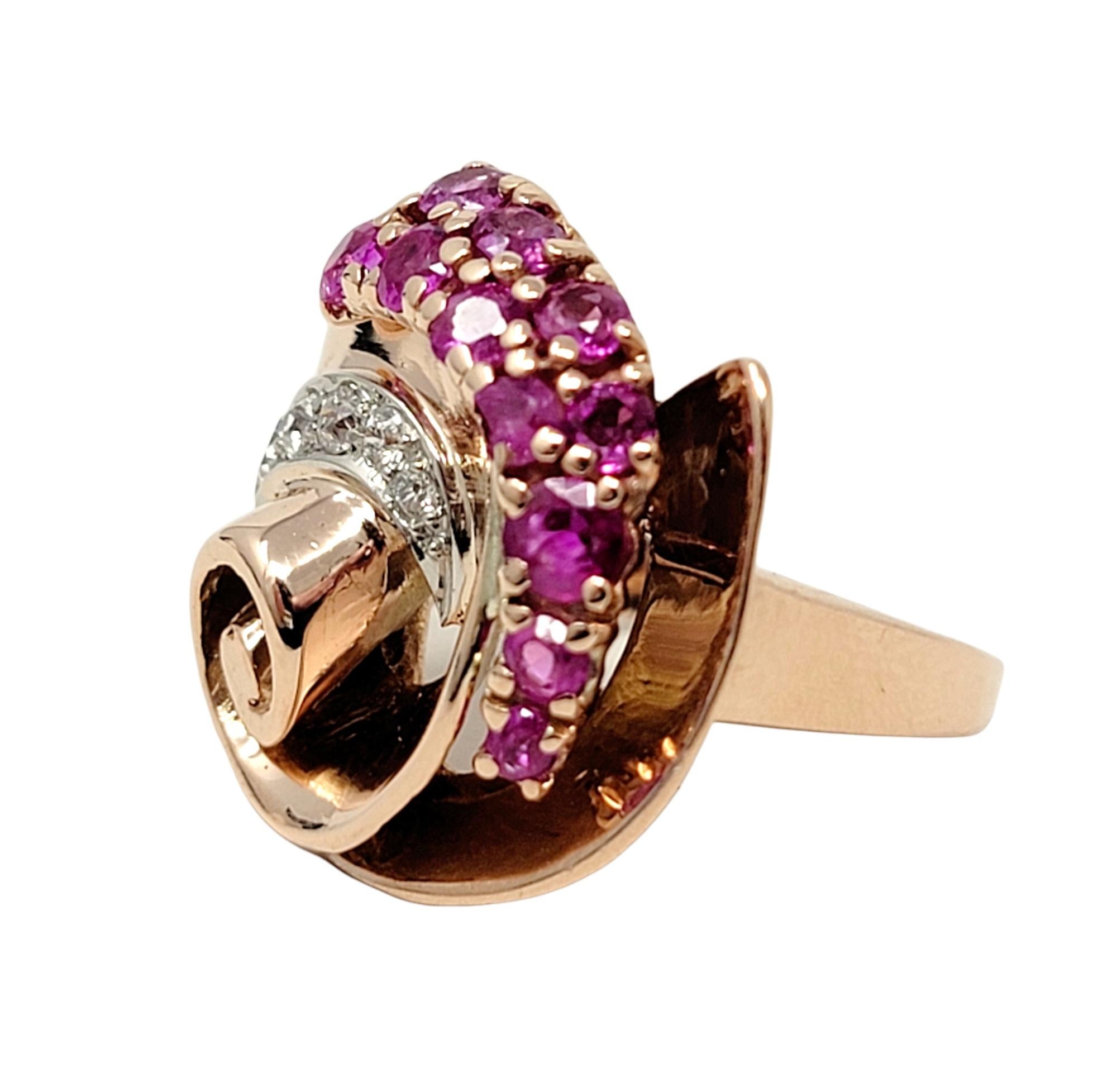 Ring size: 6.25

Gorgeous, one of a kind rose gold swirl ring with ruby and diamond accents. This colorful, artsy ring is embellished with natural purplish-red rubies and bright white diamonds and set in an asymmetric swirl pattern. The gentle