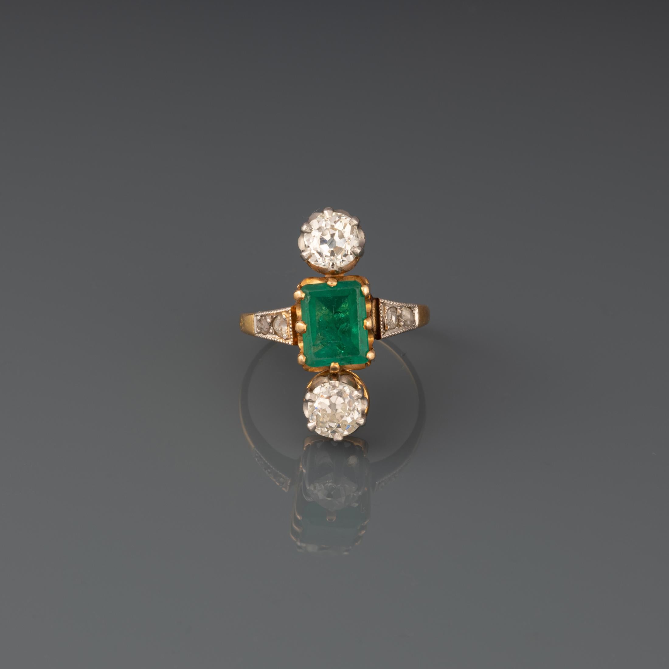 A lovely antique ring, made in France circa 1880.

Made in yellow and white gold 18k. Horse head hallmark.

The emerald weights 1.50 carats approximately, it has intense green color.

The diamonds weights 0.60 carats each approximately. They are
