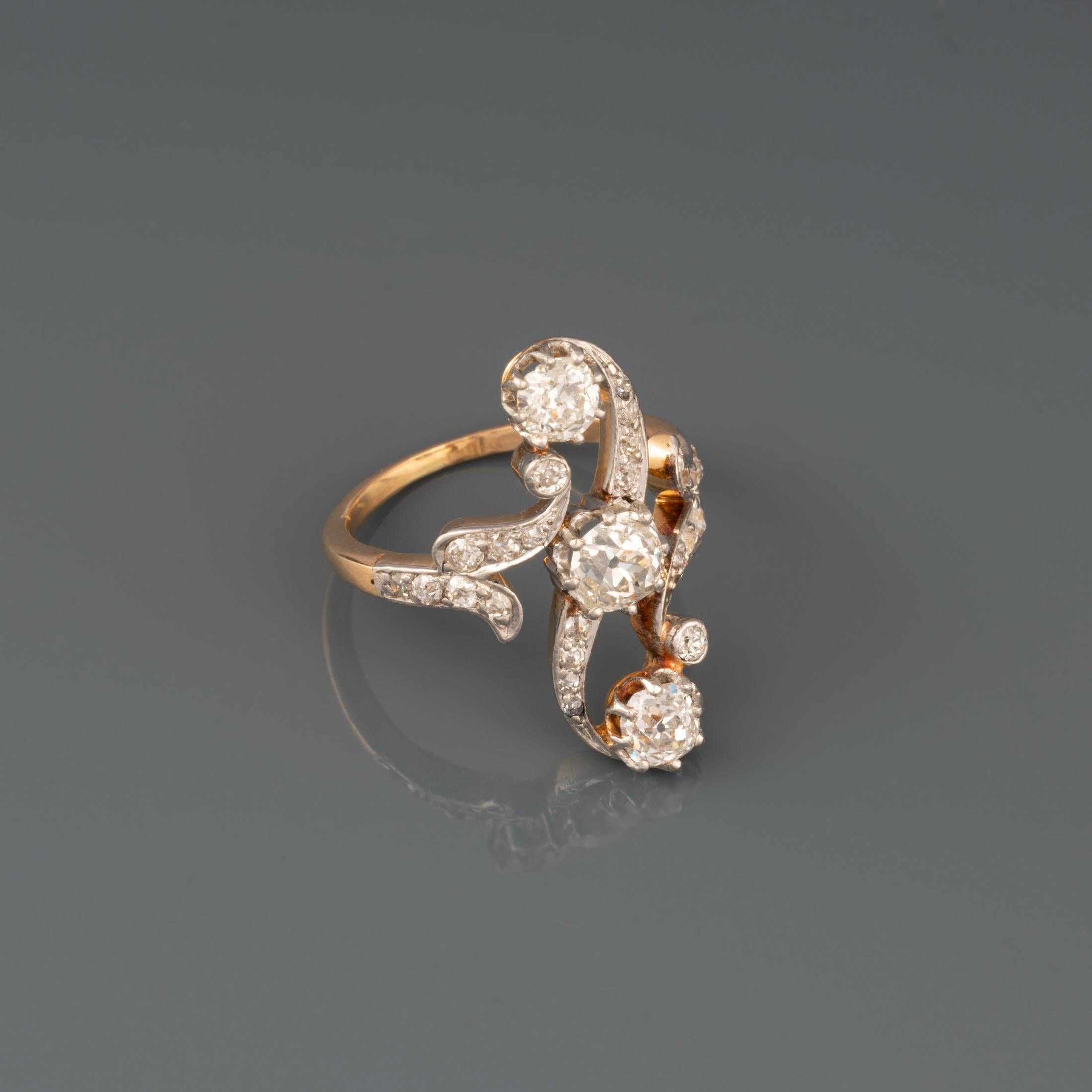 A very lovely antique ring, made in France circa 1900.

Made in yellow gold 18K and platinum.

The diamonds weights 1.2O carats total approximately. 0.45 + 0.30*2 +roses.

Dimensions: 25 *20 mm for the front / from above.

Ring size: 50 or 5.2
