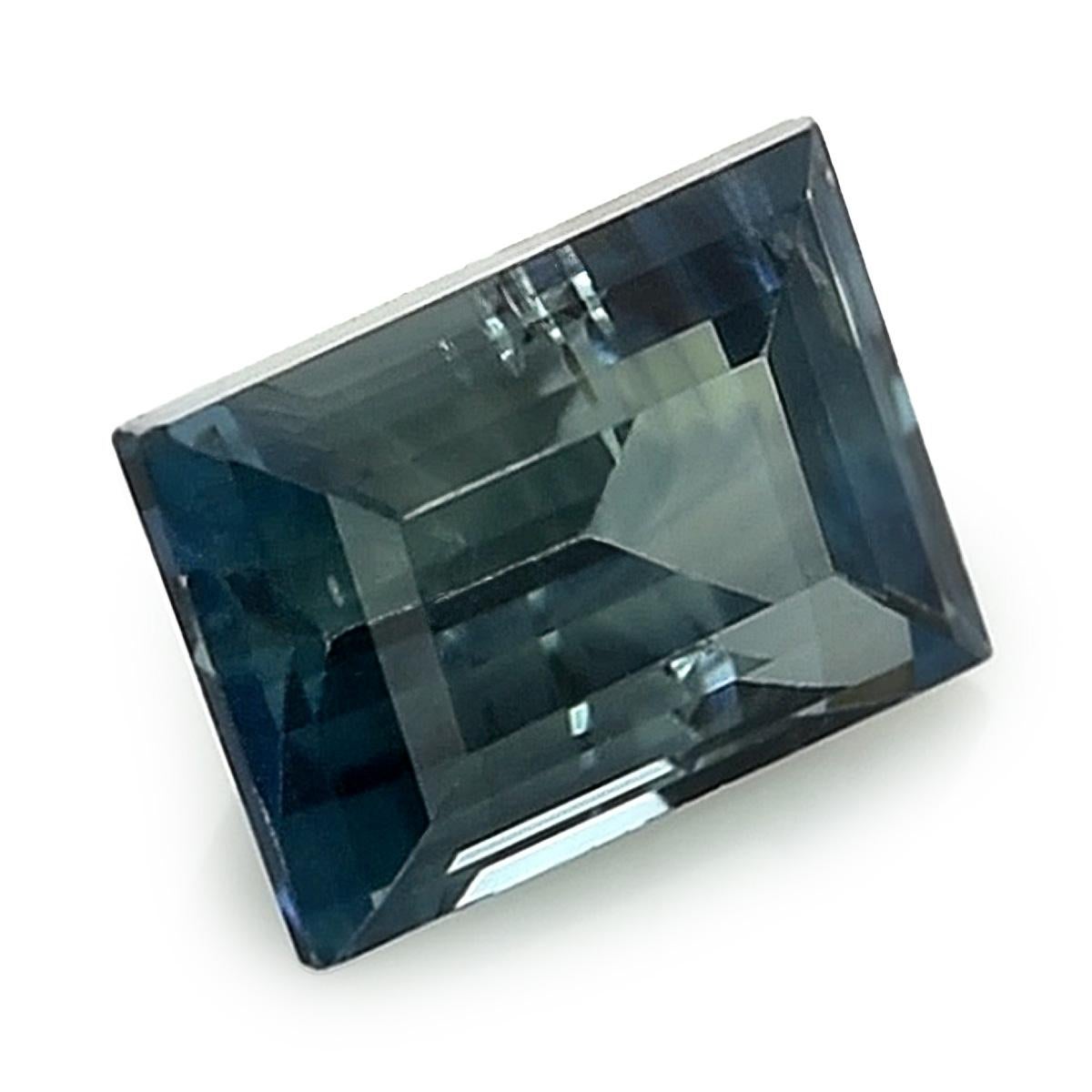 Introducing a Natural Green Blue Sapphire, graced with a weight of 1.20 carats. This enchanting gem assumes a Rectangle shape, showcasing precise measurements of 6.49 x 4.51 x 3.82 mm. Its brilliance is heightened by the Brilliant/Step cut,