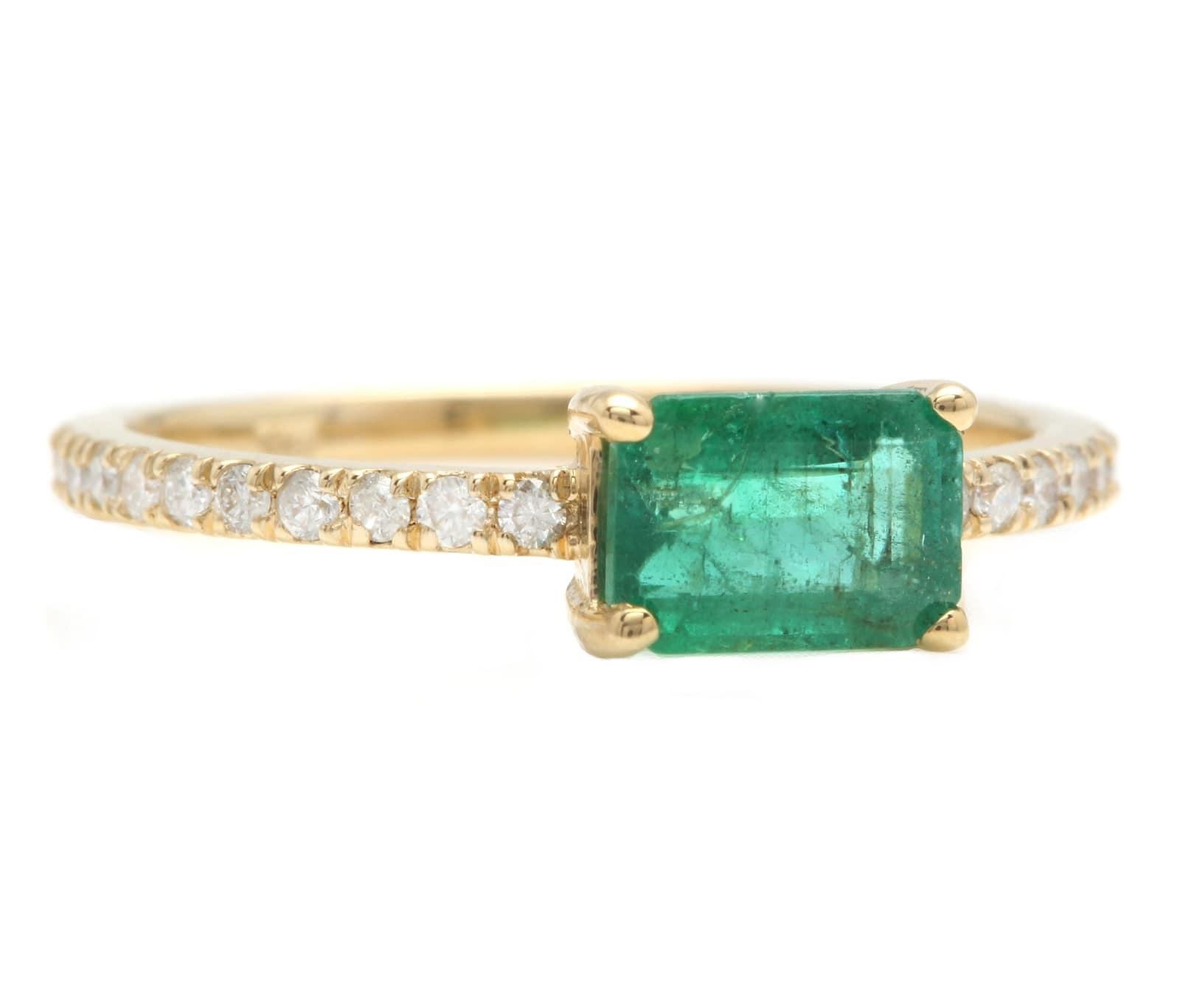 1.20 Carats Natural Emerald and Diamond 14K Solid Yellow Gold Ring

Suggested Replacement Value: $3,500.00

Total Natural Green Emerald Weight is: Approx. 0.90 Carats (transparent)

Emerald Measures: 7.00 x 5.00 mm

Natural Round Diamonds Weight: