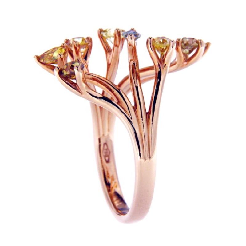 Beautiful modern cocktail ring. The ring consists of rose gold with 1.20 Ct francy colour diamonds mixed cut. 
Total weight: 4.96 grams
Metal: rose Gold 18KT
New contemporary jewelry. 
US Ring size 7 please see the conversion in the picture for