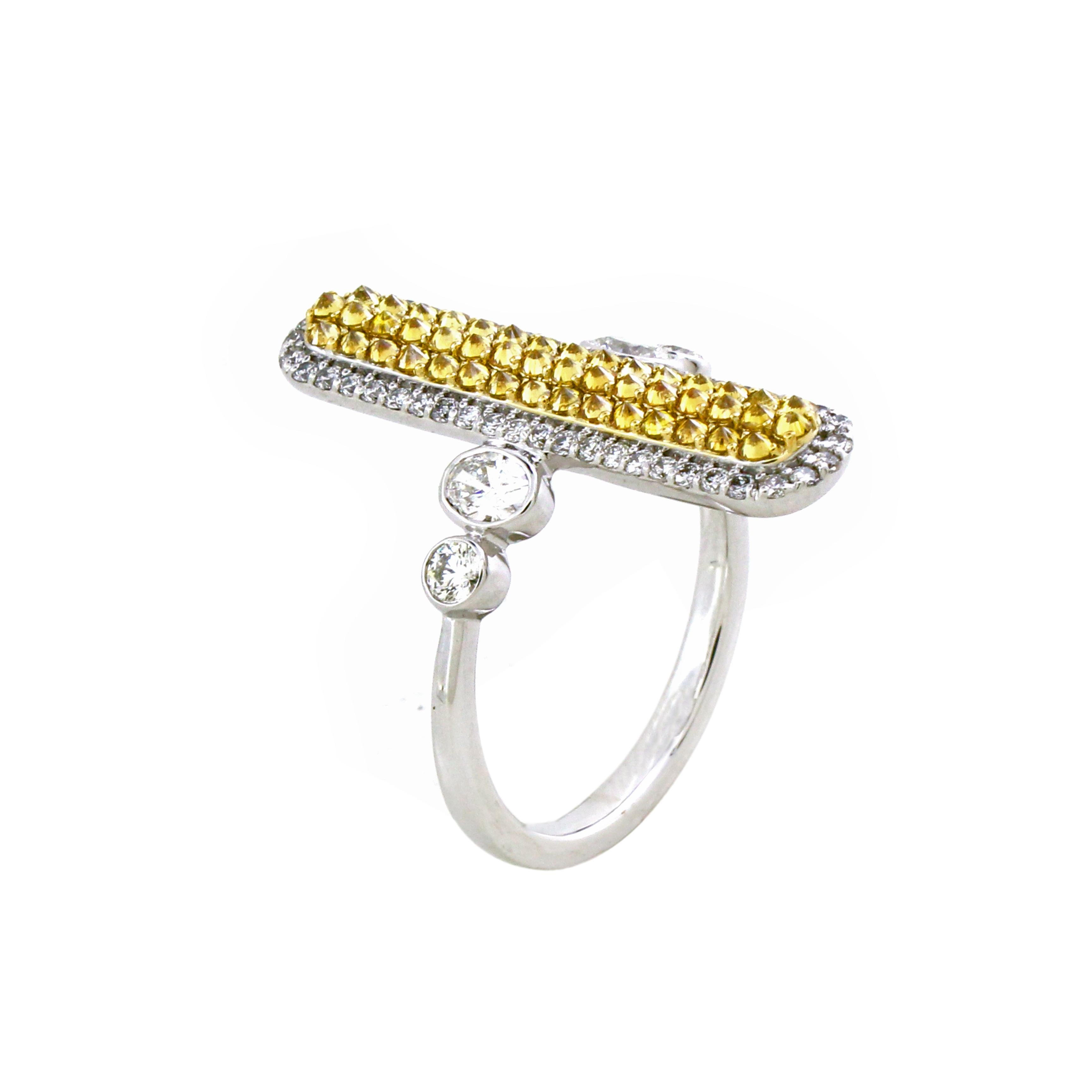 This striking ring features 46 round cut diamonds, totaling 0.56 carats, uniquely set upside down to resemble brilliant-cut pyramids. These inverted diamonds form an elongated design, creating a modern and eye-catching aesthetic. The ring is further