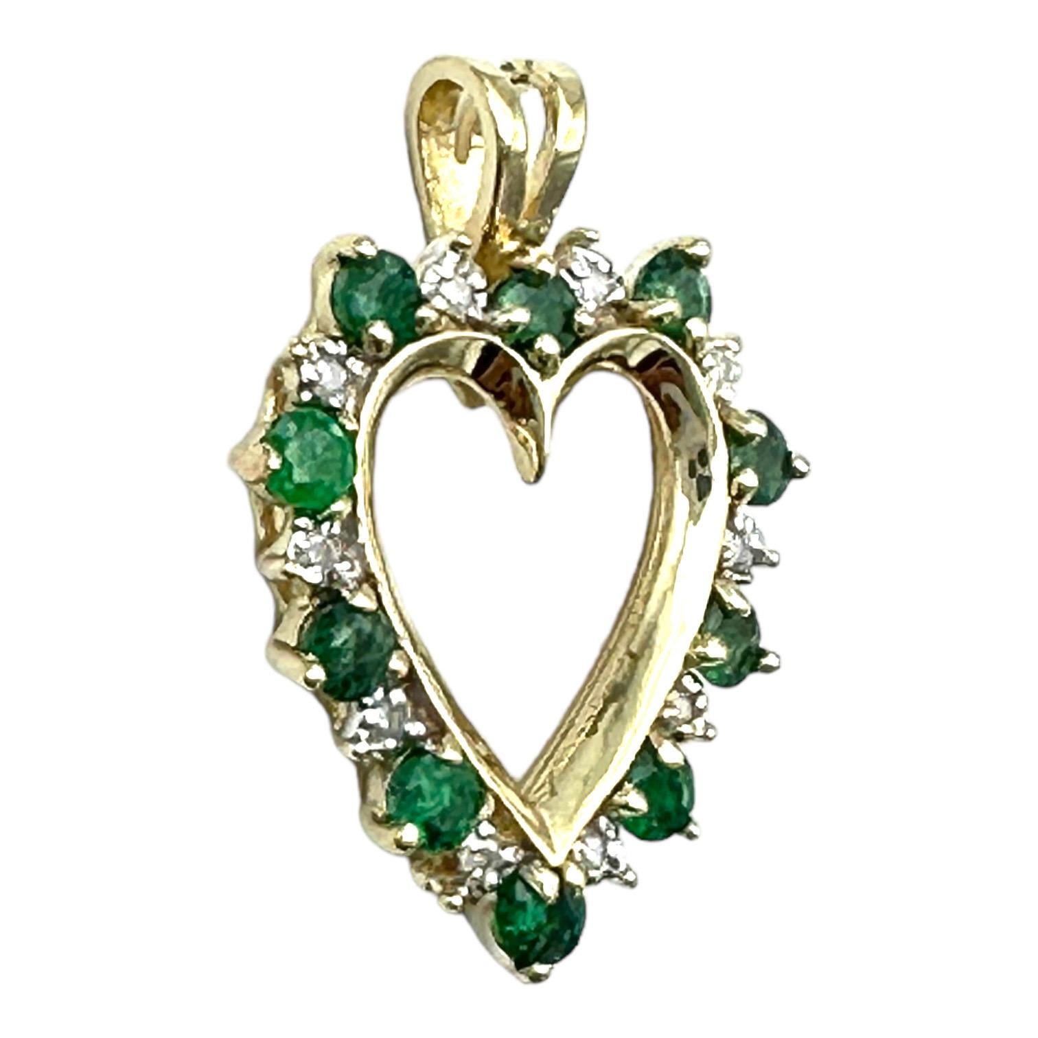 This heart pendant measures 23 x 18 mm and includes the chain bail to accommodate a 4 mm width. The emeralds are a hunter, jewel green alternating by round brilliant diamonds. The pendant's total gemstone weight is 1.20 carat.
This beautiful pendant