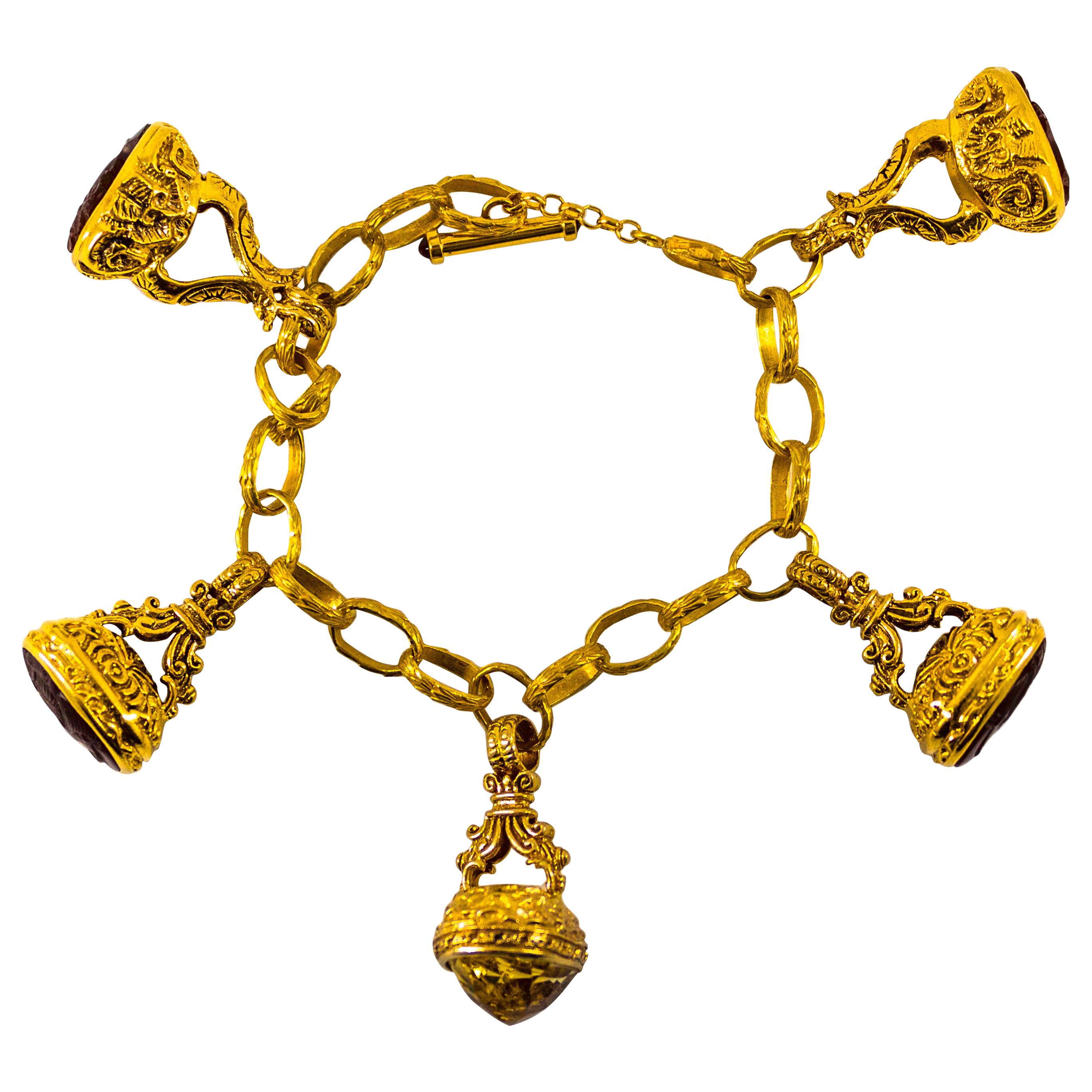 12.00 Carat Citrine 0.24 Carat Ruby Carnelian Yellow Gold Charm Bracelet