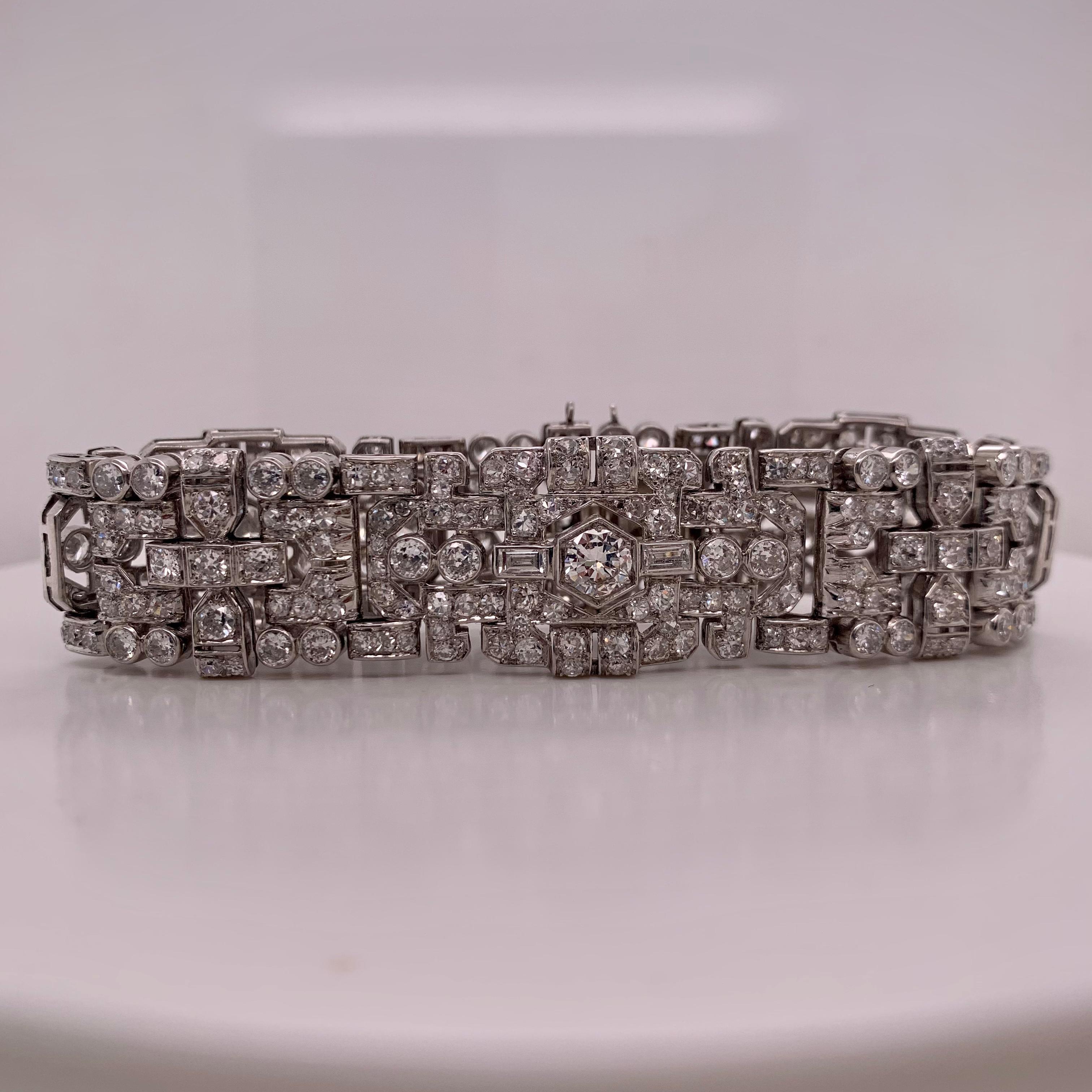 An antique bracelet from the 1920s. This diamond bracelet features 12.00 carats of diamonds, carefully selected for their G-H color and VS-SI clarity, ensuring a display of light and brilliance. 

Crafted in solid 18k gold with a substantial weight