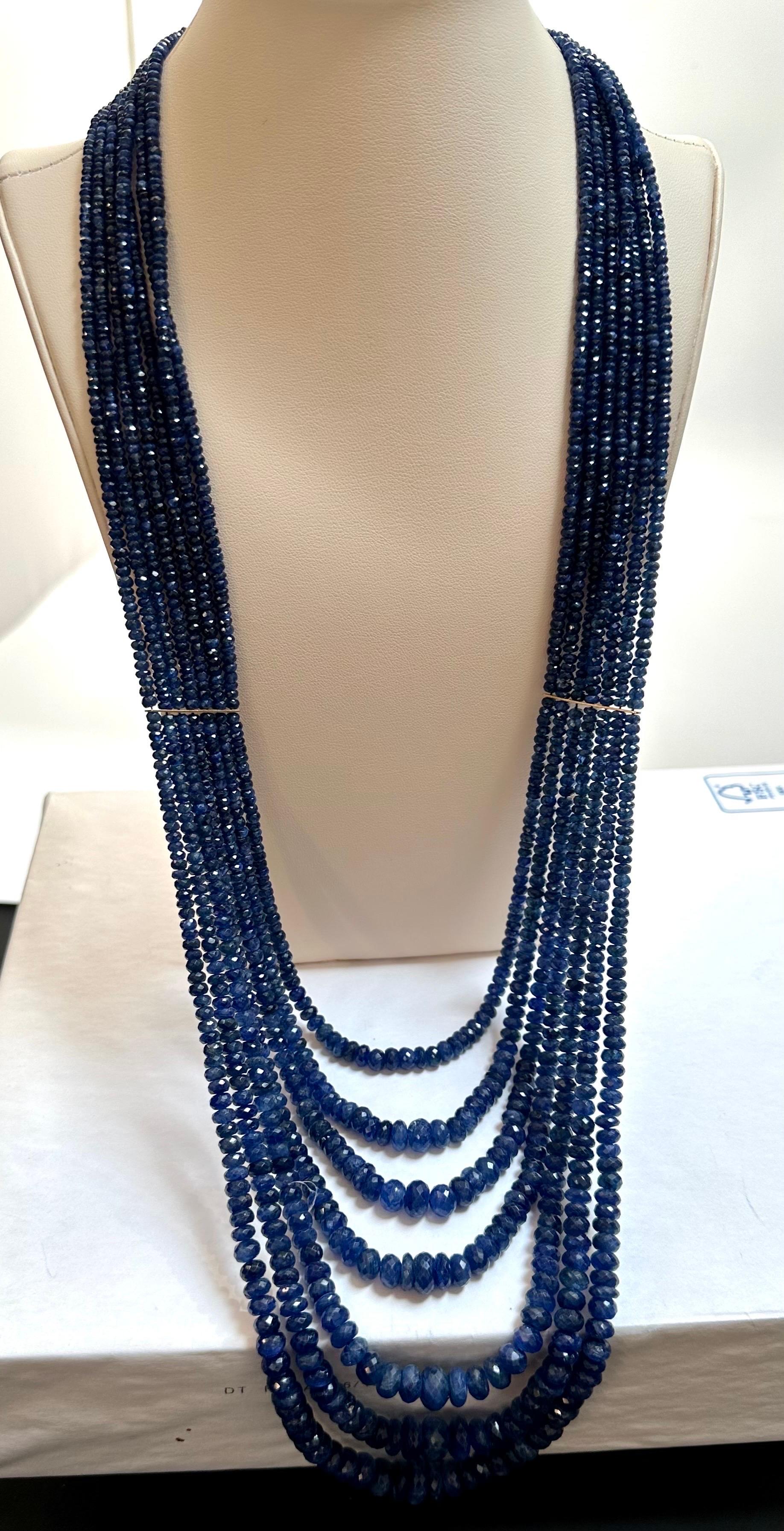 Approximately 1200 Carat Natural  very fine Sapphire Bead Seven  Strand Necklace with Spacers in  14 Karat yellow Gold, 32 inch long 
All natural beads , no color enhancement
32