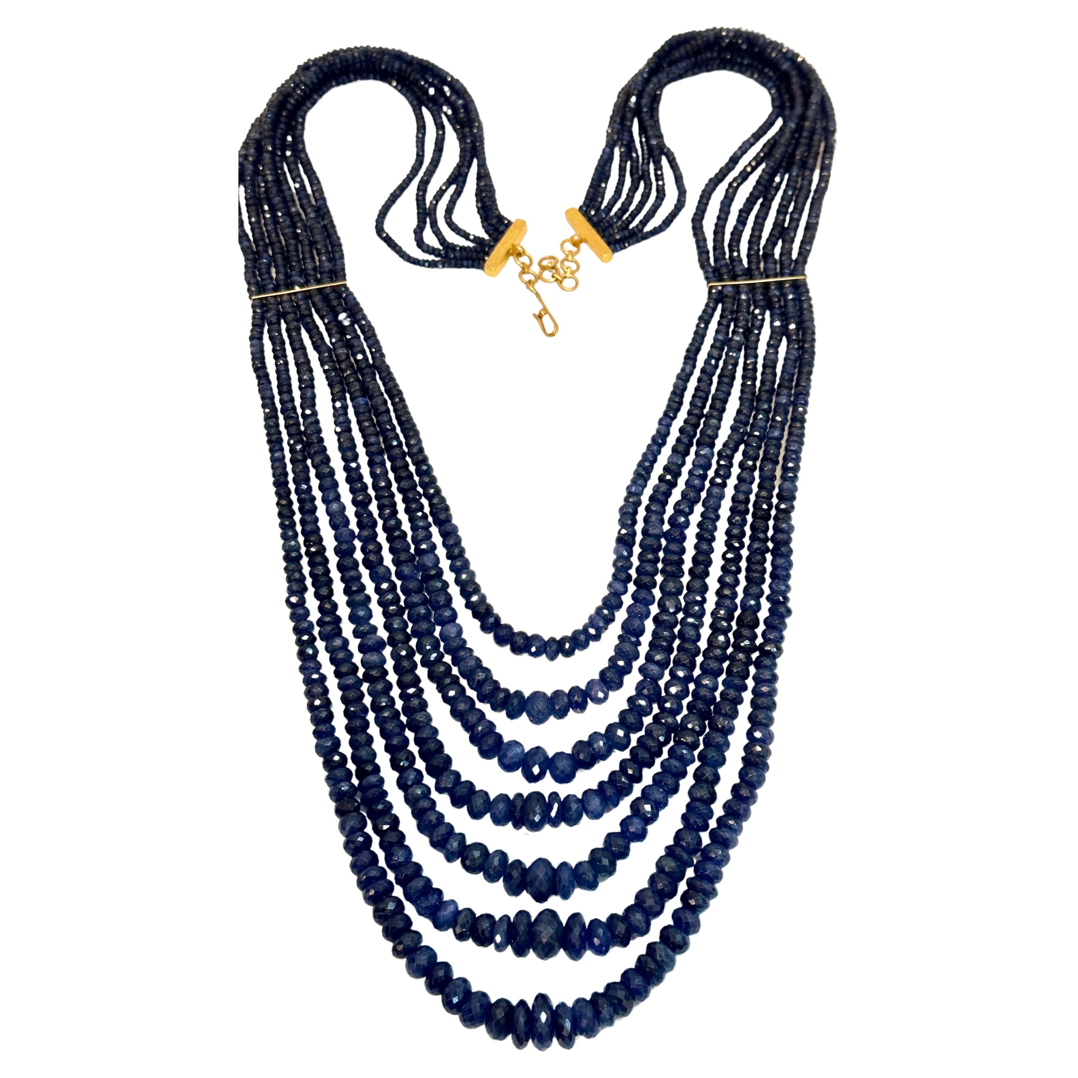 Approximately 760 Carat Natural  very fine Sapphire Bead Seven  Strand Necklace with Spacers in  14 Karat yellow Gold
All natural beads , no color enhancement
28