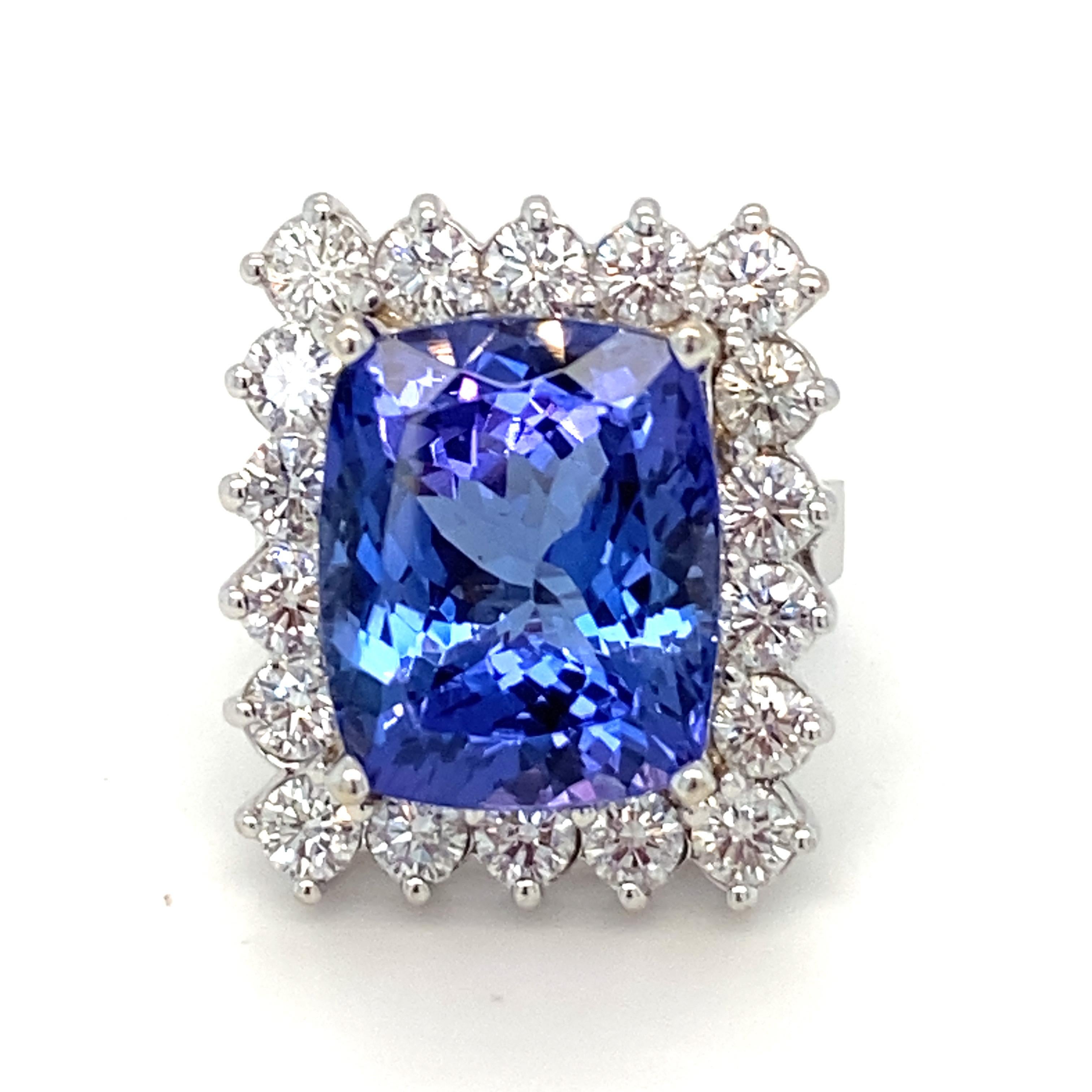 Stunning halo  ring showcases 12 Carat rectangular cushion framed by 2.86 carat white diamond. Set in 18K white gold with prong setting. Size is 6.5, resizable.