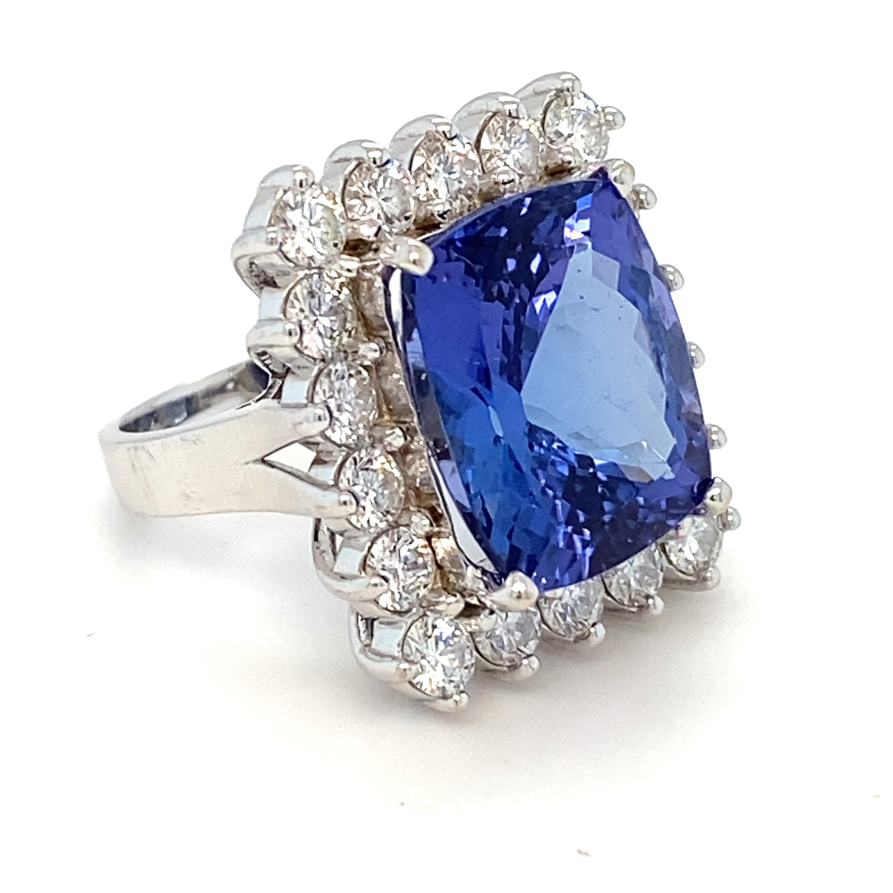 Contemporary 12.00 Carat Tanzanite Diamond White Gold Halo Ring For Sale