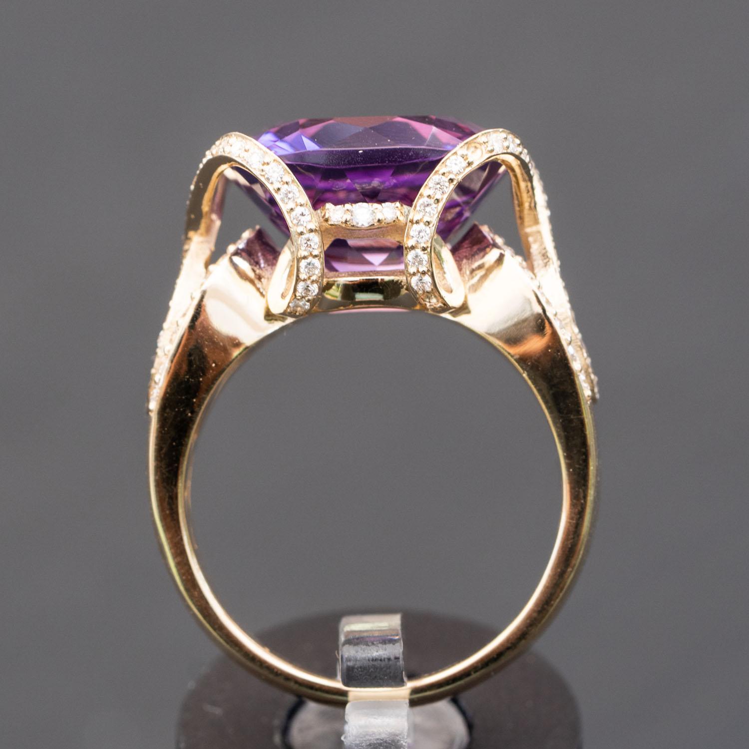 This design features 1.25 carat of VS white untreated natural diamonds, the perfect contrast to the translucent purple of this 12.00 carat natural Amethyst ring. The smooth yellow gold band offers a beautifully balanced texture to this natural