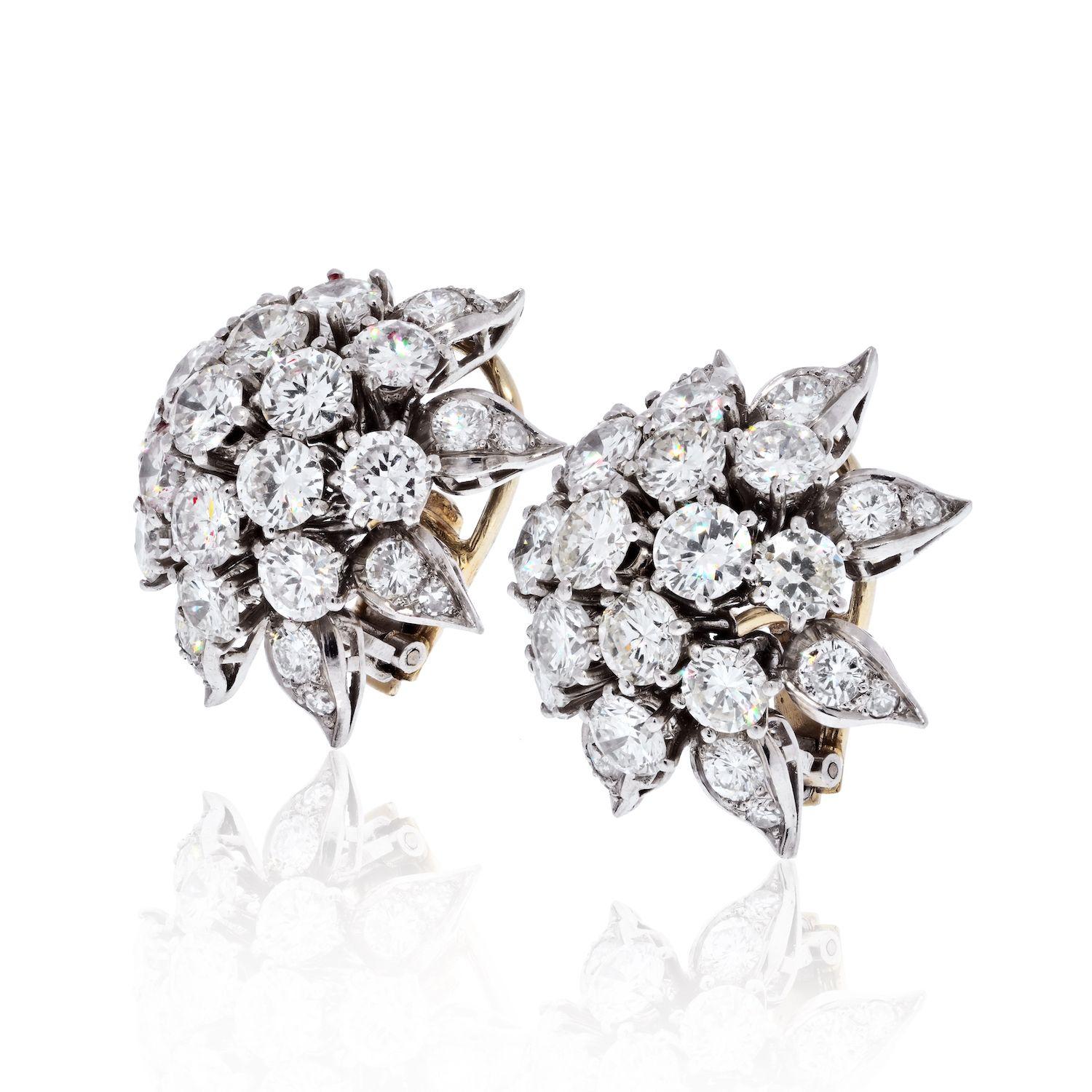 These estate cluster earrings are exquisite in every way. Round diamond burst cluster earrings in Platinum set with 12 carats of diamonds.
24mm wide. 
Diamond quality G-H color, VS-SI clarity.
Heavy omega backing for non-pierced ears. 
