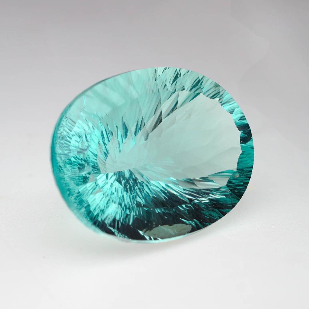 This impressive 120.4 carat natural Fluorite gemstone is a museum-caliber specimen showcasing the stunning luminosity and color zoning for which Fluorite is prized. With remarkable clarity and a unique hue that shifts gently in the light, this large