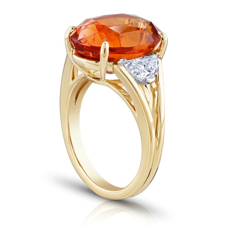 12.04 carat Oval Orange Sapphire with two Half Moon Diamonds 0.72 carats set in a handmade 18k YG ring
