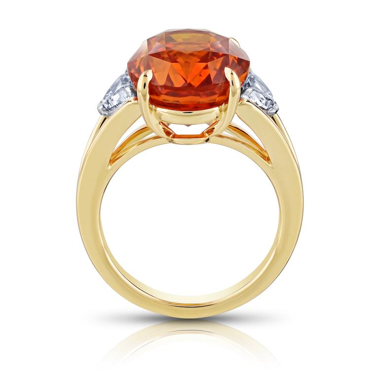 Contemporary 12.04 carat Oval Orange Sapphire with two Half Moon Diamonds in 18k YG ring For Sale