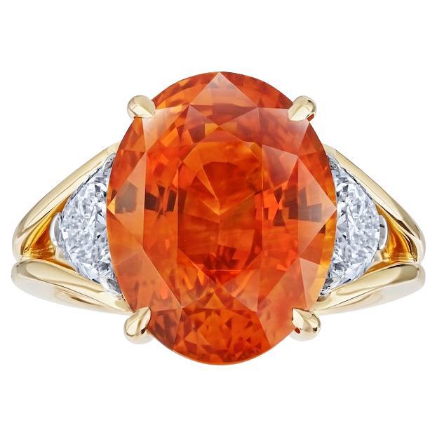 12.04 carat Oval Orange Sapphire with two Half Moon Diamonds in 18k YG ring For Sale