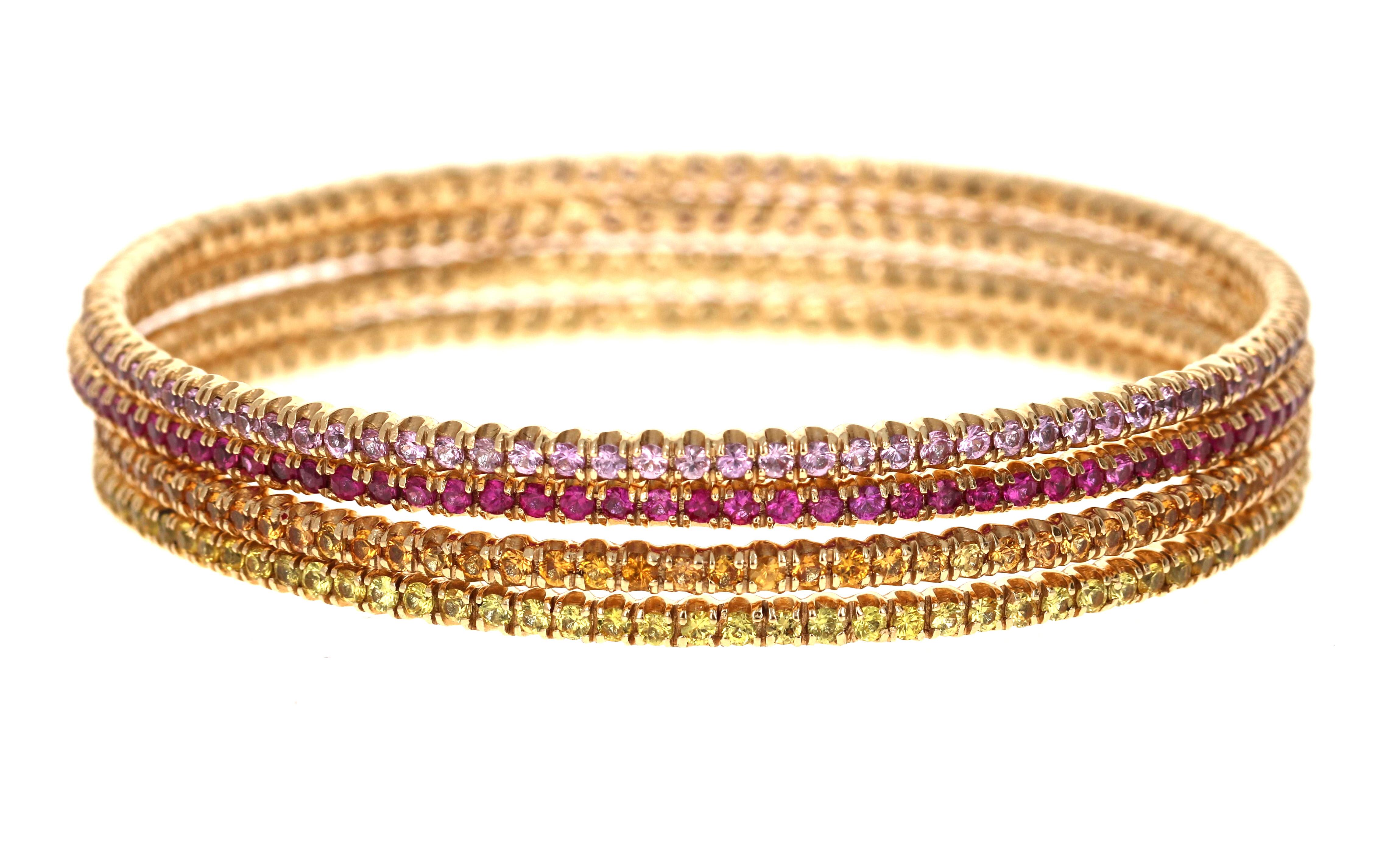 12.05 Carats Round Cut Pink Sapphire, Yellow Sapphire and Orange Sapphire Yellow Gold Stackable Bangles!

Set of 4 elegant and classy 12.05 Carat Sapphire Stack-able, Eternity Bangles that are sure to be a great addition to your accessory