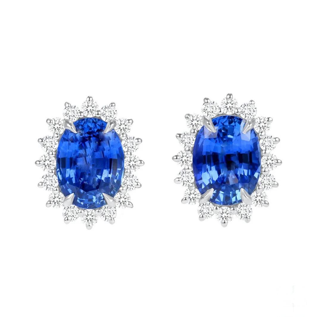 12.06 carats of Ceylon Sapphires are the stars of these surreal platinum earrings. Highlighted by round white diamonds, weighing a total of 1.72 carats. The sapphires are accompanied by GIA reports. 