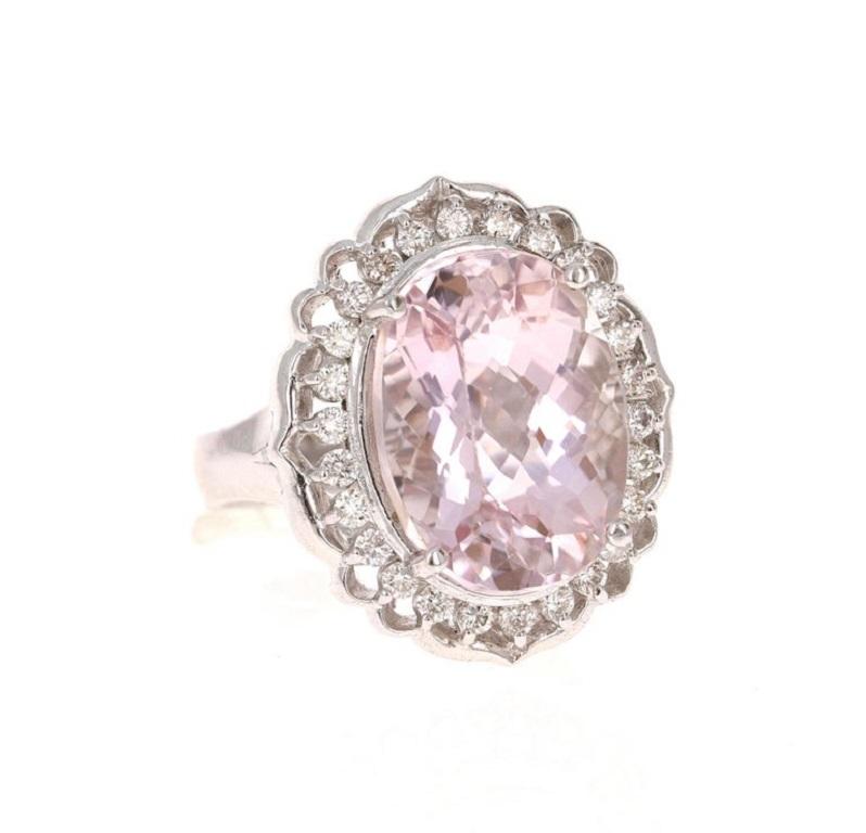 This gorgeous Kunzite Diamond Ring has a 11.53 Carat Oval Cut Kunzite as its center and is surrounded by 26 Round Cut Diamonds that weigh 0.56 carats. The total carat weight of the ring is 12.09 carats.

It is set in 14 Karat White Gold and weighs