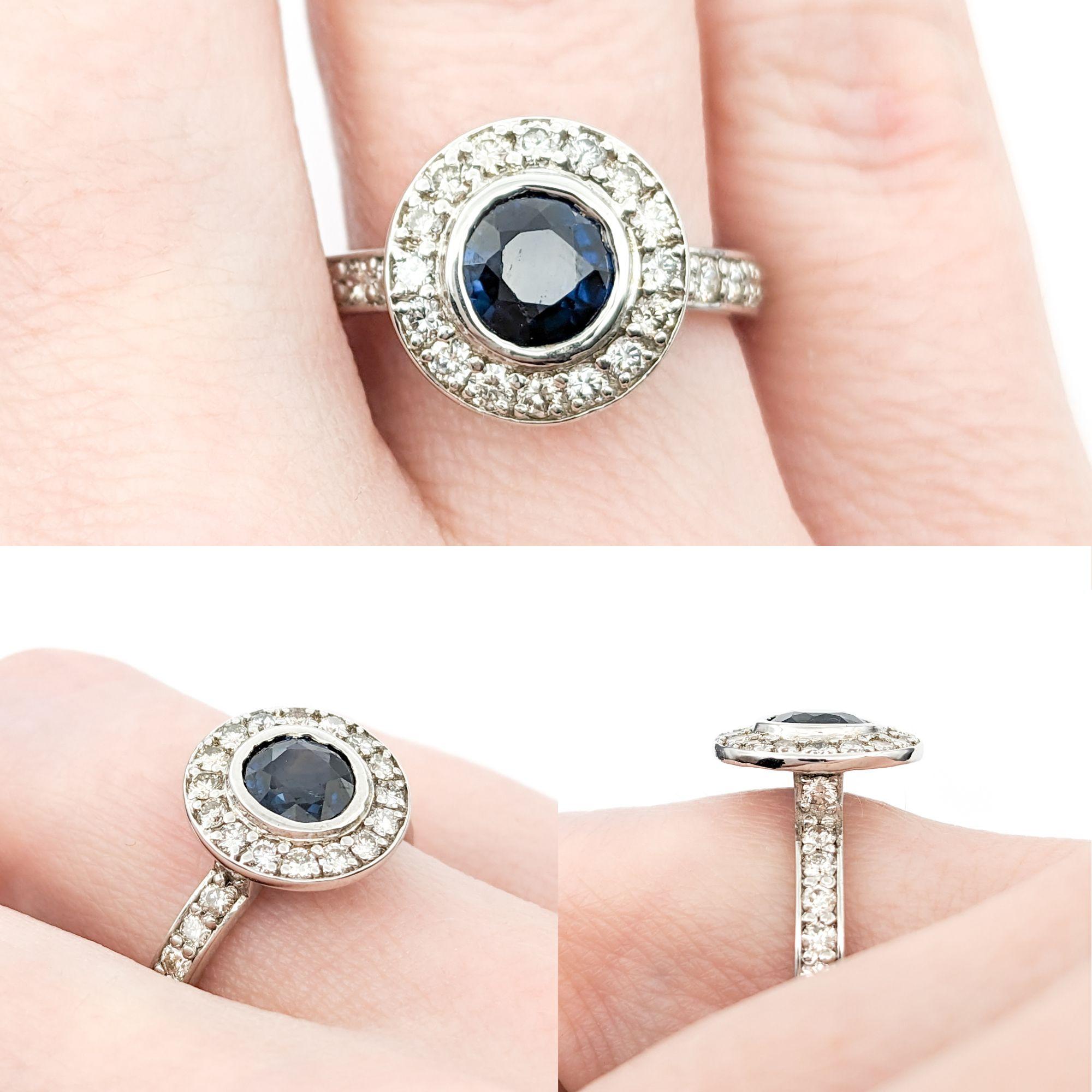 1.20ct Blue Sapphire & 1ctw Diamond Ring In White Gold

Introducing a stunning ring crafted in 14kt white gold, featuring a 1.20ct Sapphire centerpiece alongside 1.00ctw of round diamonds. The diamonds, noted for their SI-I clarity and near