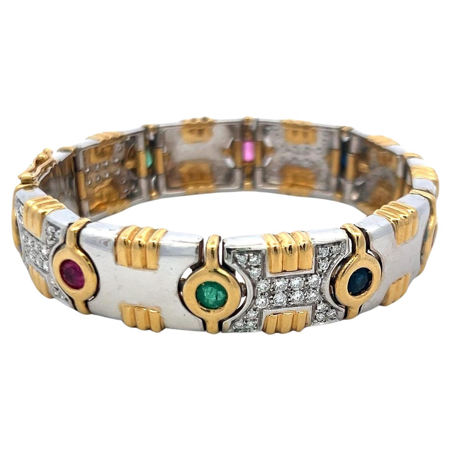 Bracelet Link en or 18 carats composé de 1,20 carats de diamants, 0,80 carats d
émeraudes, 0,60 carats de rubis et de saphirs en vente