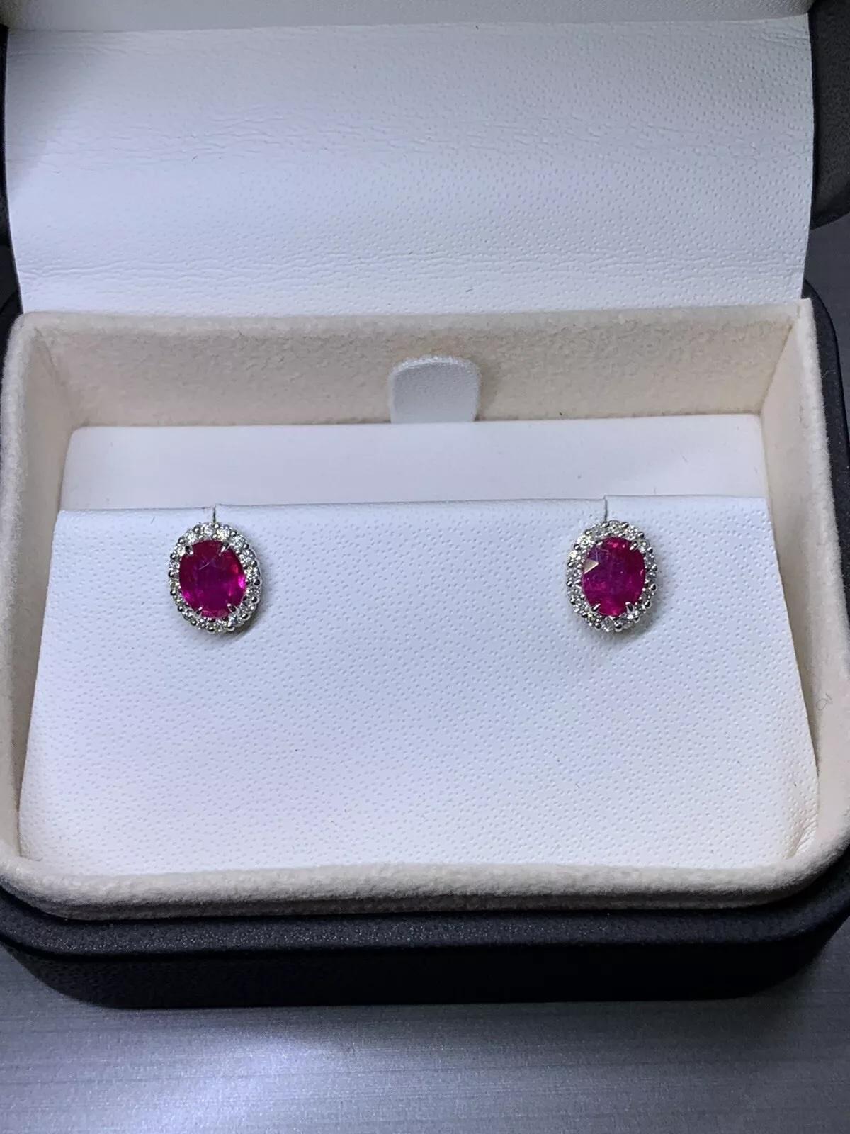 1.20ct Diamonds and oval ruby halo stud earrings in 18k white gold. In New Condition For Sale In London, GB