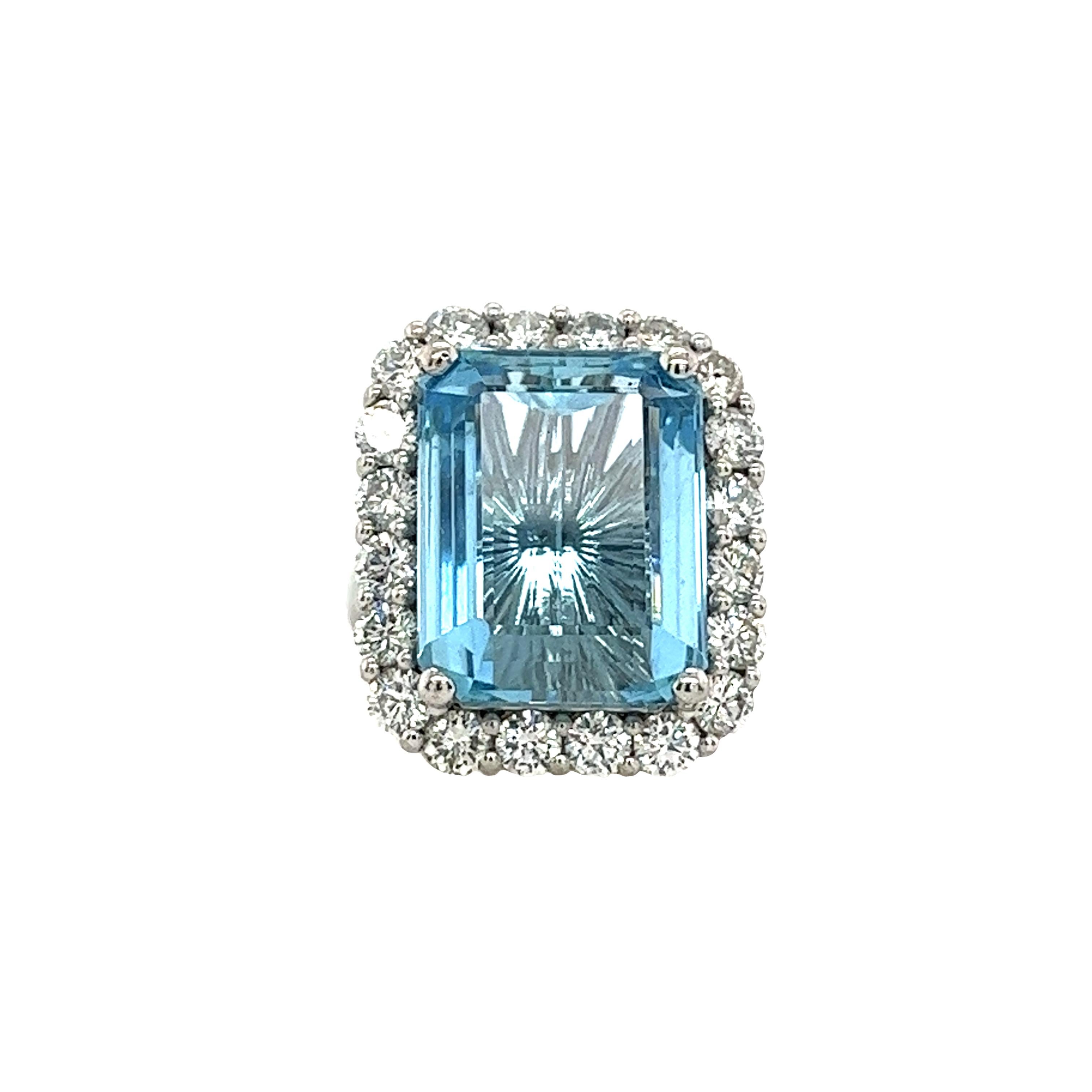 This gorgeous 12ct fine quality aquamarine ring
surrounded by 20 round brilliant  cut diamonds,
with a total diamond weight of 2.90ct G/VS natural diamonds,
is set in platinum setting. 

This is a unique and eye-catching dress/cocktail ring.
Total