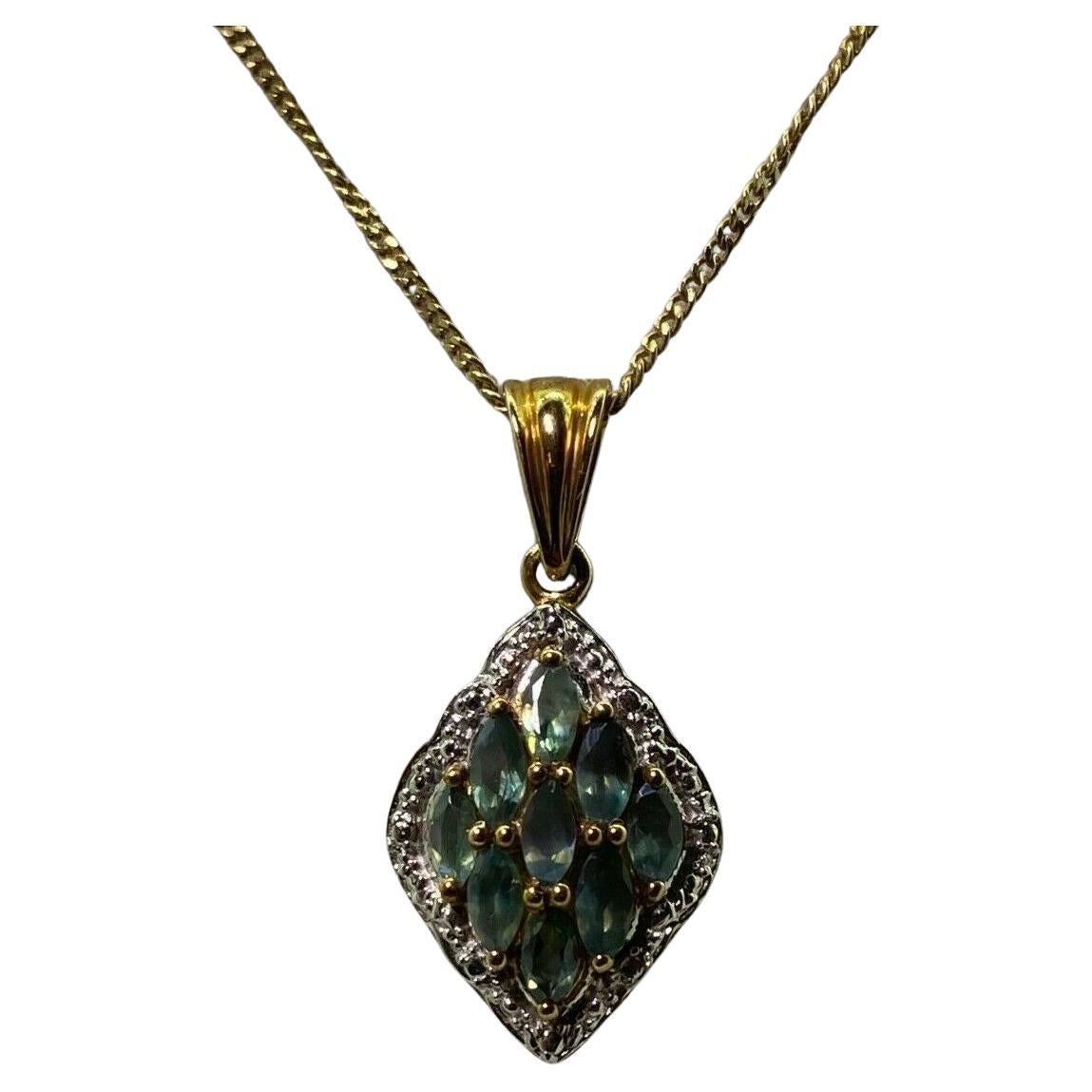 Set with 9 Oval Natural Greenish Blue Sapphires 
of 1.20ct in total approx.

within rosy gold claw setting 

within an illusion setting 
crafted in 9K White & Rose Gold 

Total item's weight: 3.3gr. 
Dimensions of the pendant: 30mm (including bail)