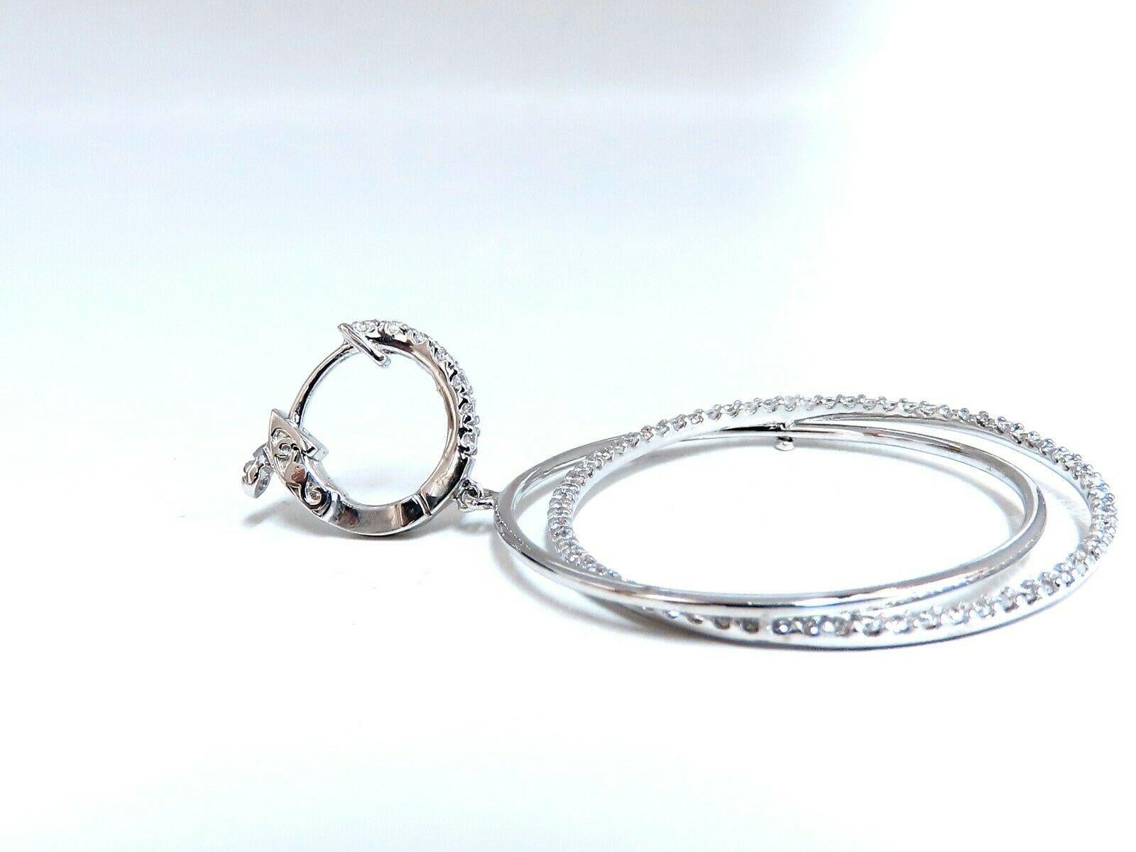 Circle loop earrings.

The Modern Dangle.

1.20cts of natural round diamonds: 

G-color, Vs-2 clarity.

14kt. white gold

9.2 grams.

Earrings measure: 2.25 inch long 

1.25 inch diameter on each ring

.50 inch hoop

Comfortable Lever snap on the