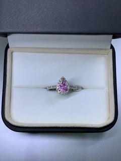 1.20ct Pink sapphire vivid pear diamond halo engagement ring 18k white gold.