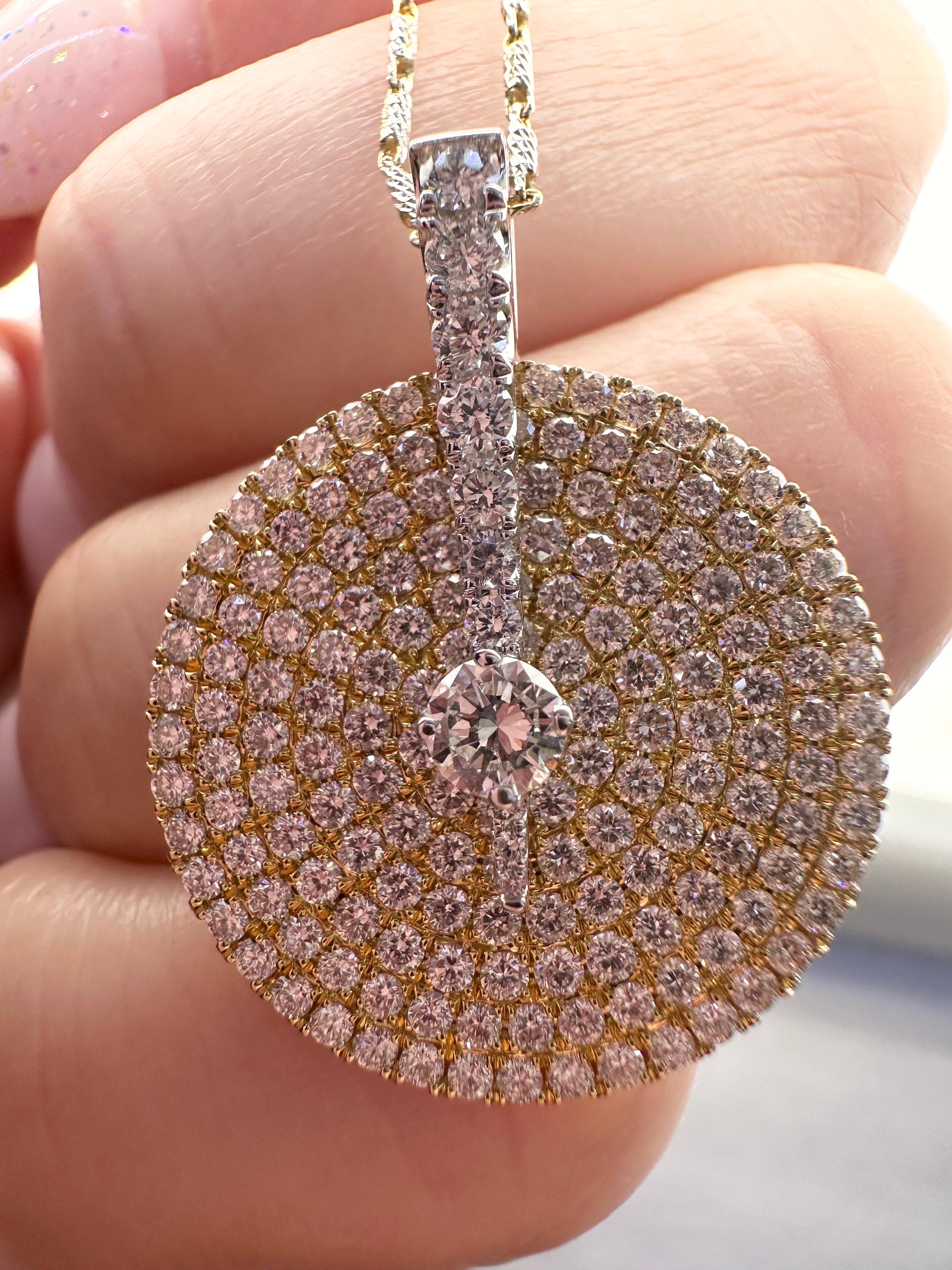 
Stunning moving pendant necklace in 18KT yellow gold made with 1.20 ct of diamonds VS clarity and F color. Chain is 18