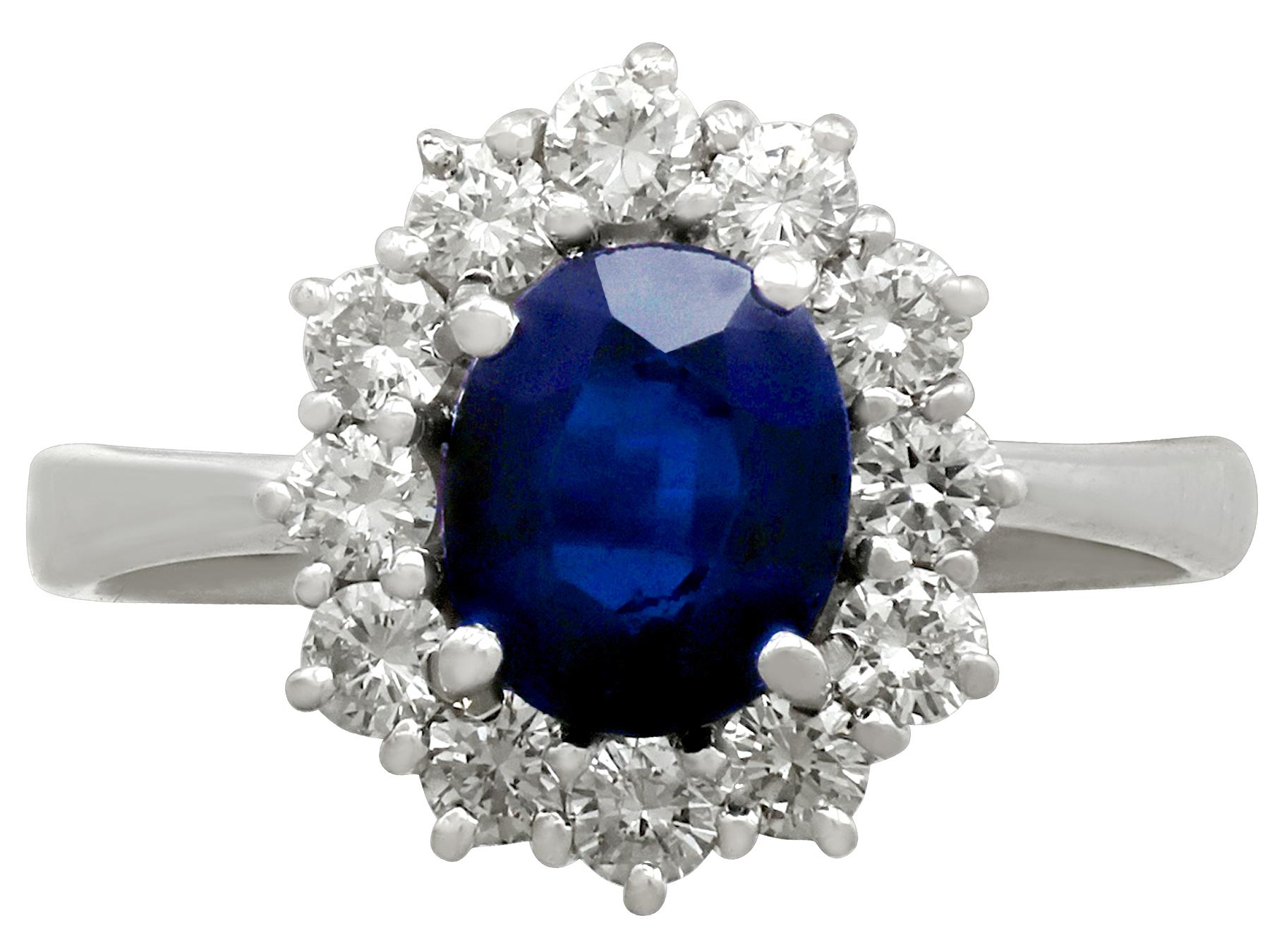 A fine and impressive vintage 1.20 carat natural blue sapphire and 0.60 carat diamond, 18 karat white gold cluster ring; part of our vintage jewelry and estate jewelry collection

This fine and vintage sapphire and diamond cluster ring has been