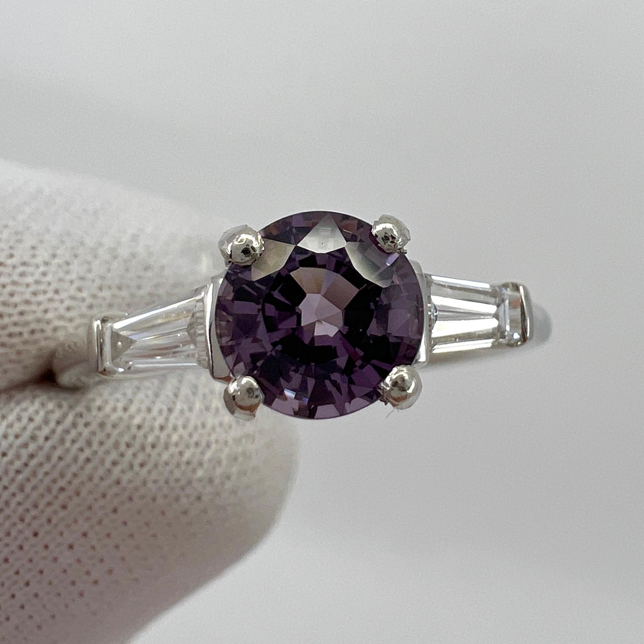 Natural Vivid Lilac Purple Spinel & Diamond Platinum Round Cut Three Stone Ring. 1.20 Total carat.

1.00 Carat natural spinel with a unique vivid purple lilac colour and excellent clarity. Very clean stone.

The spinel measures 6mm with an excellent
