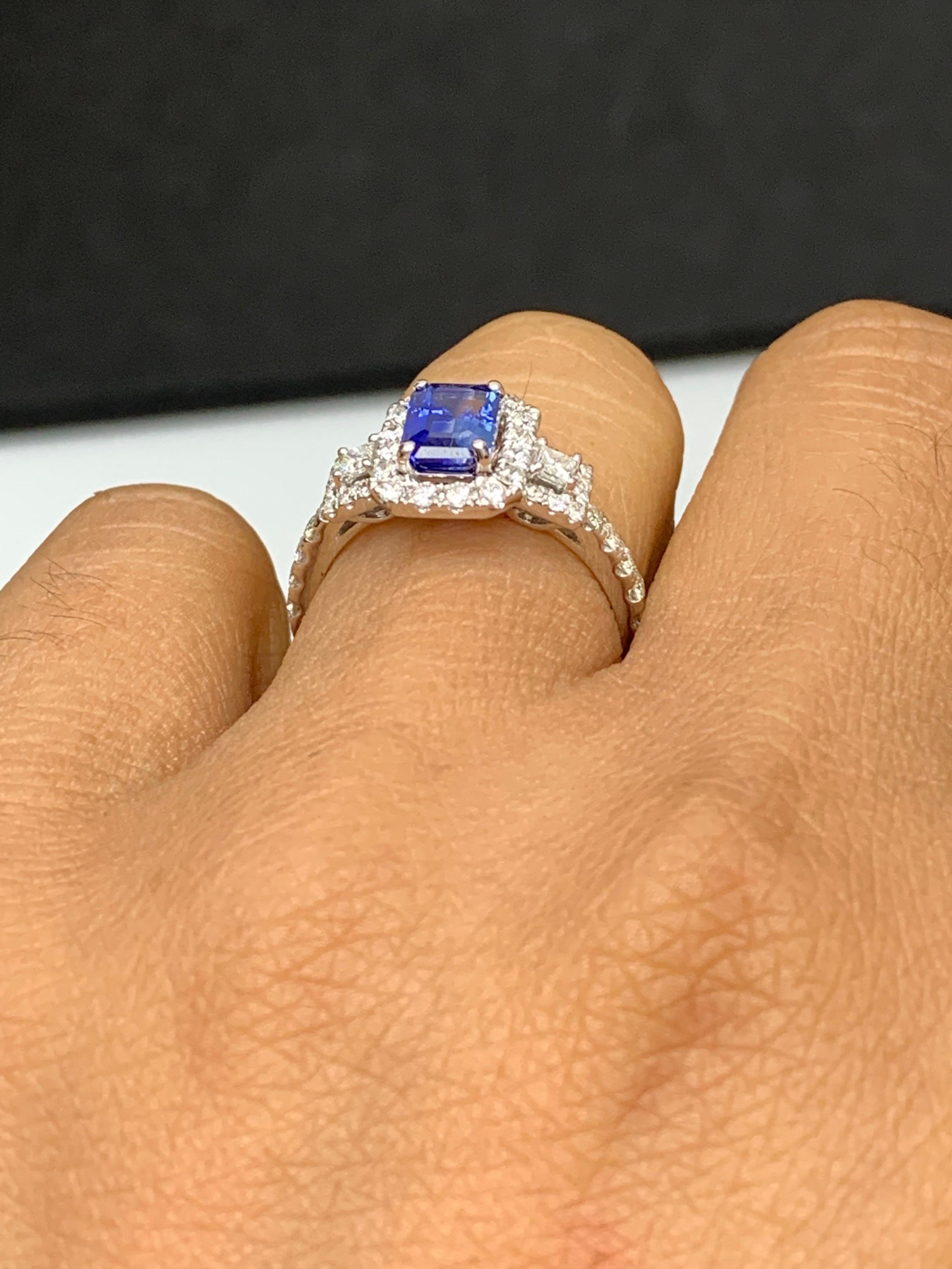 Modern 1.21 Carat Emerald Cut Blue Sapphire and Diamond Halo Ring in 18K White Gold For Sale
